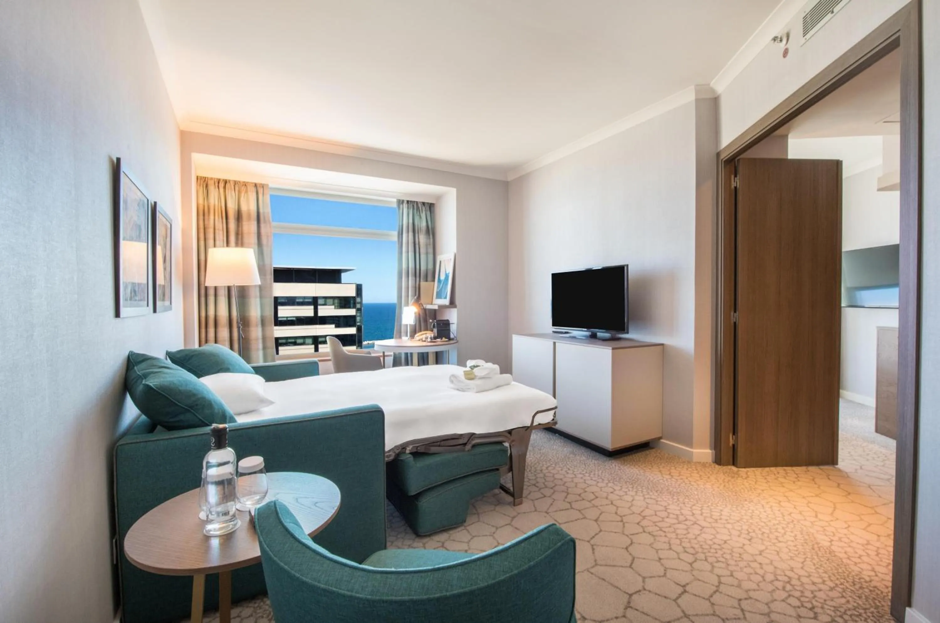 Living room, Bed in Hilton Diagonal Mar Barcelona