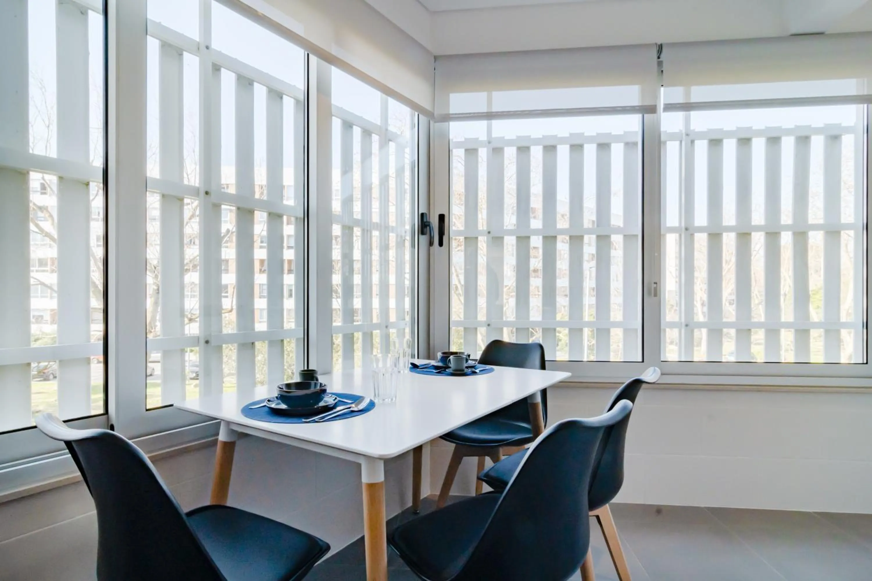 Dining area in Coastal Charm by LovelyStay