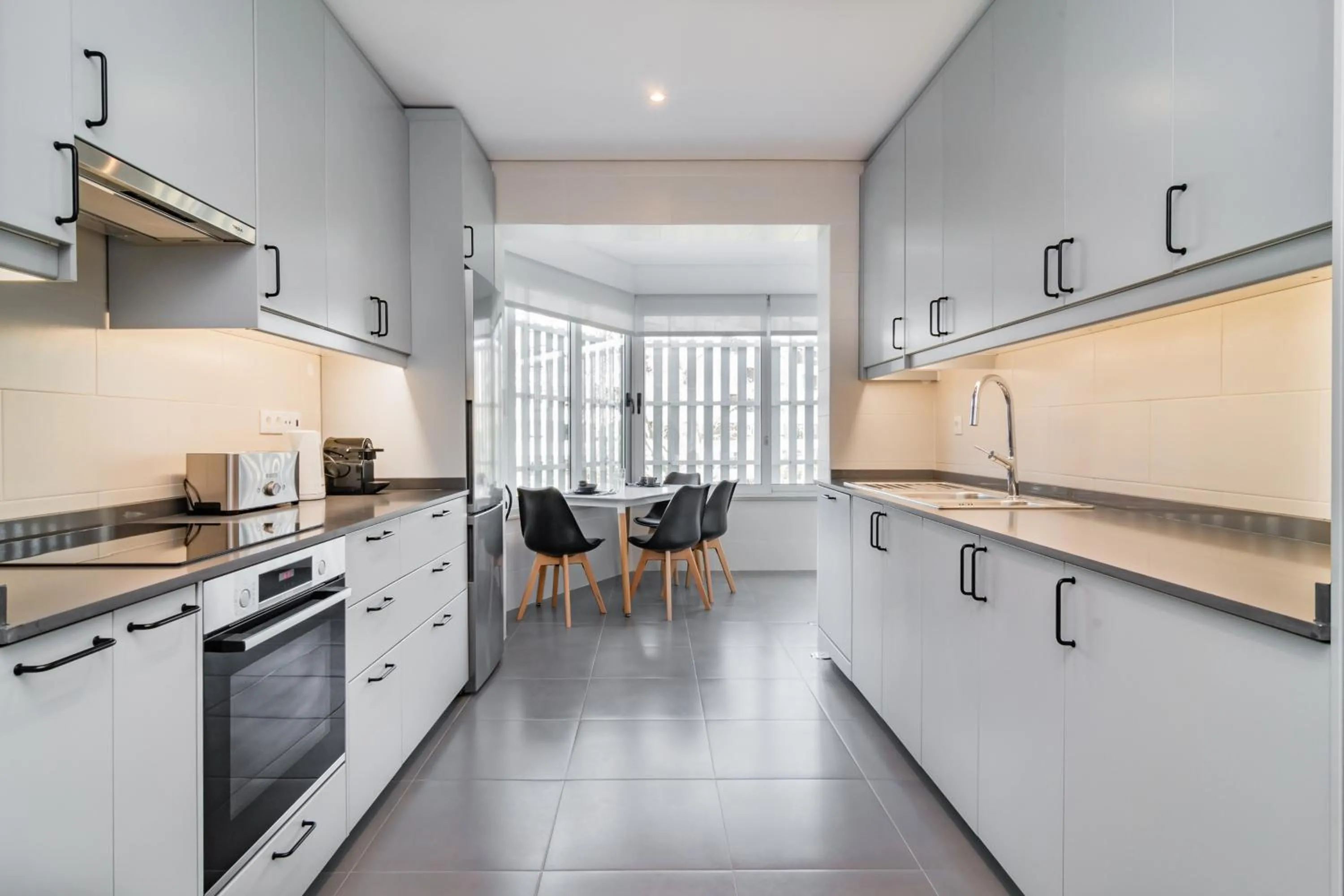 Kitchen or kitchenette in Coastal Charm by LovelyStay