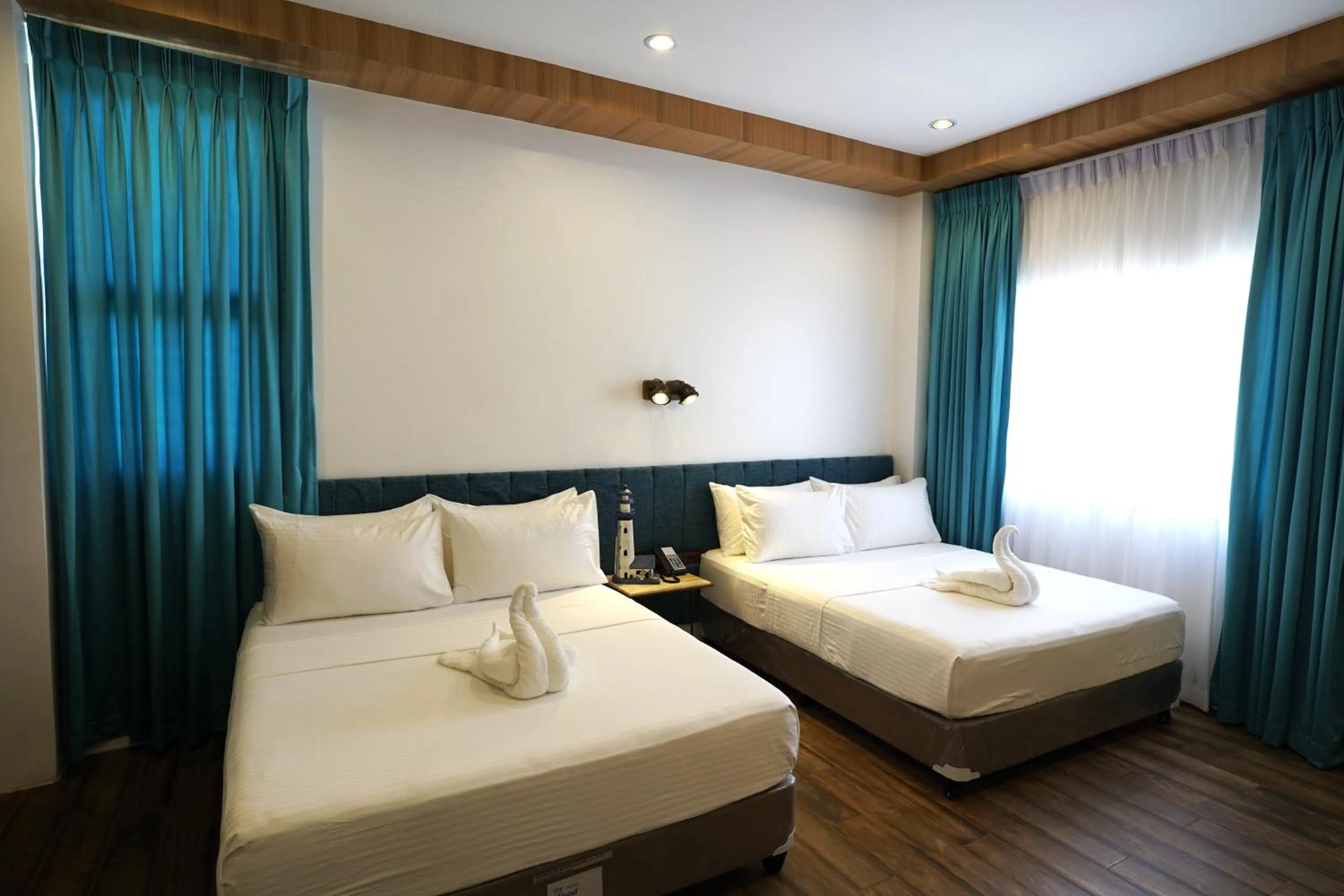 Bed in Lighthouse Point Hotel