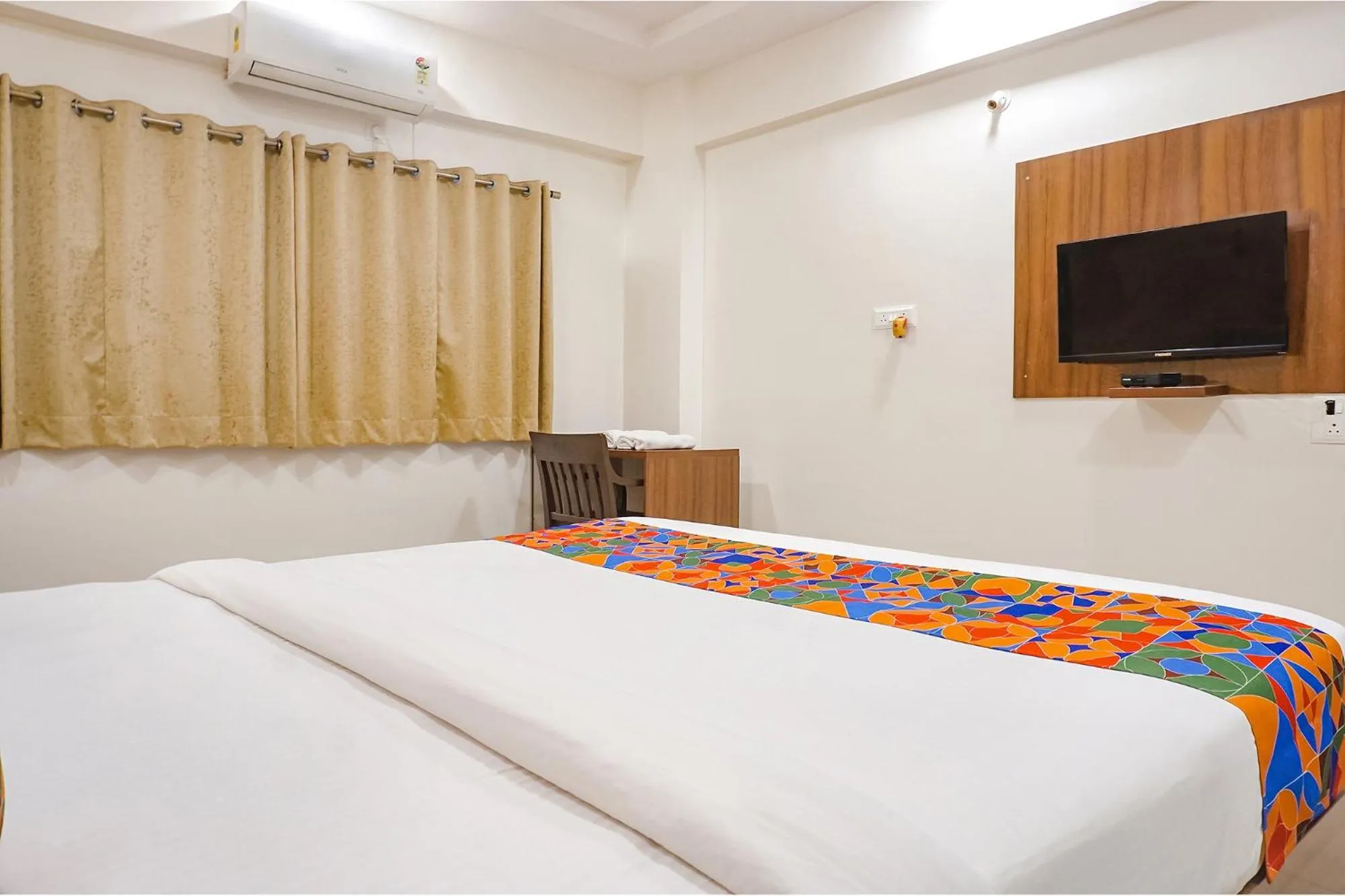 Bed in FabHotel Embassy near Amanora Mall