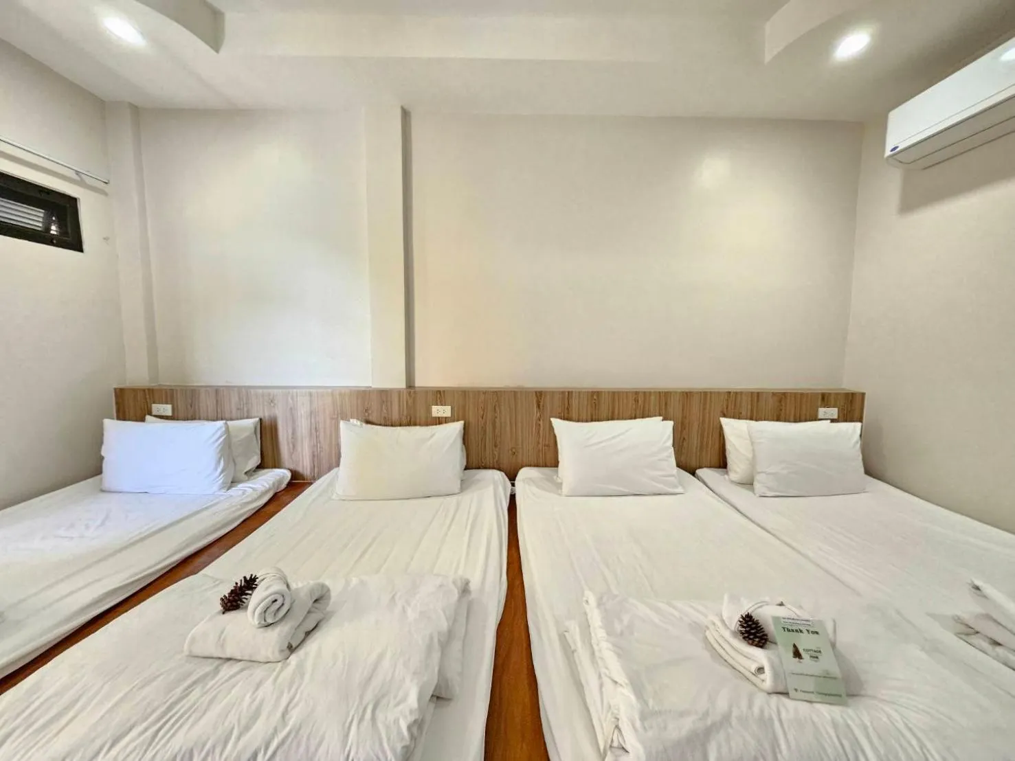 Bed in CottagePine Rayong Resort&Cafe