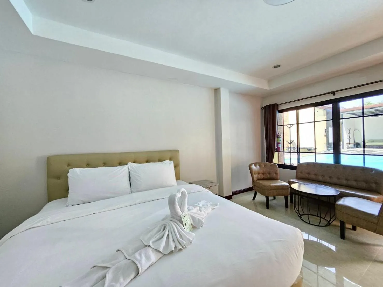 Bed in CottagePine Rayong Resort&Cafe