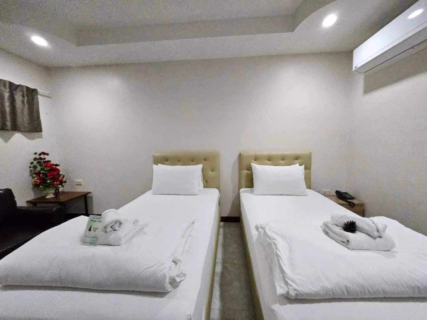 Bed in CottagePine Rayong Resort&Cafe