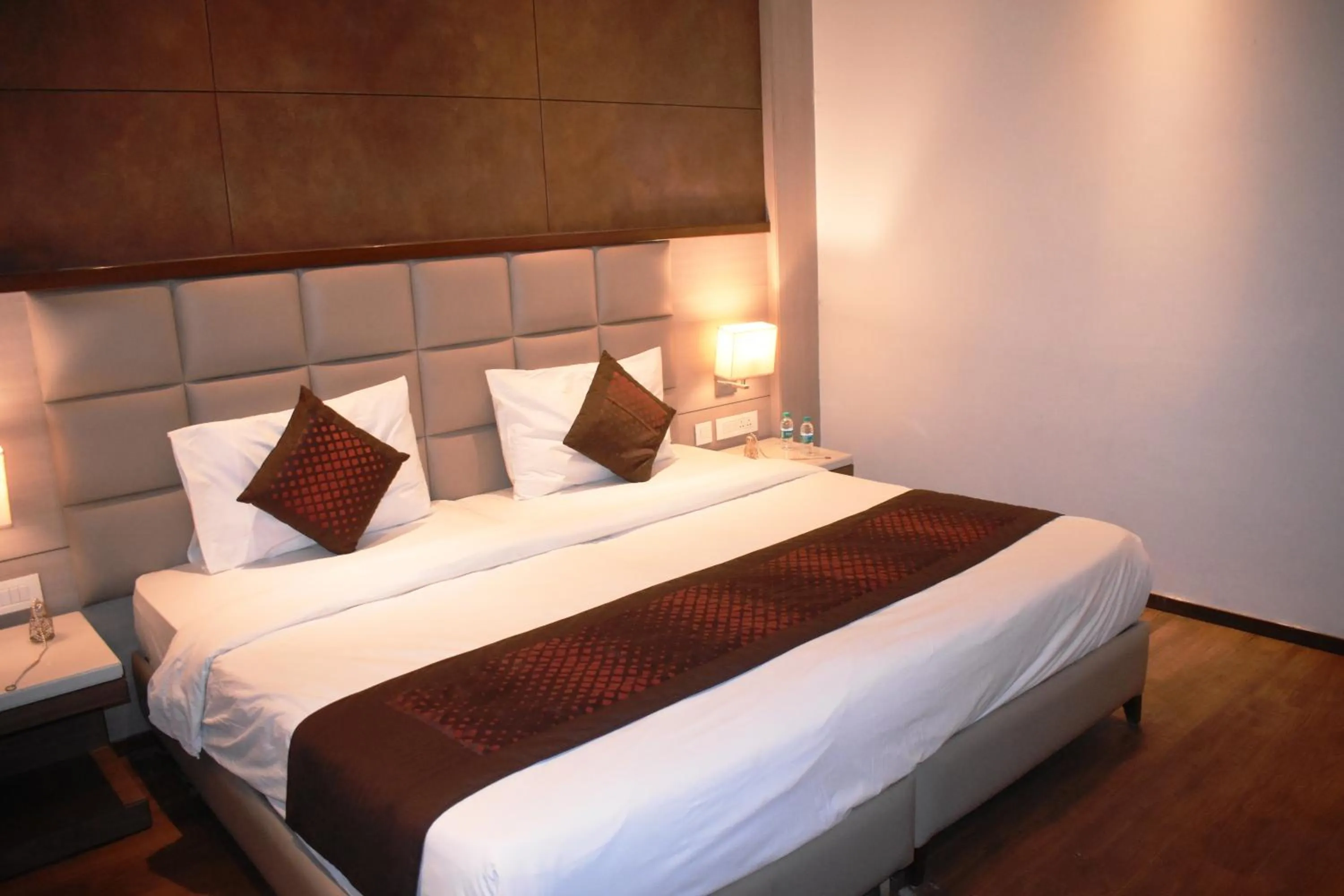 Bedroom, Bed in Lemonwood Suites by F9 Hotels - Trivoli Garden Chhatarpur