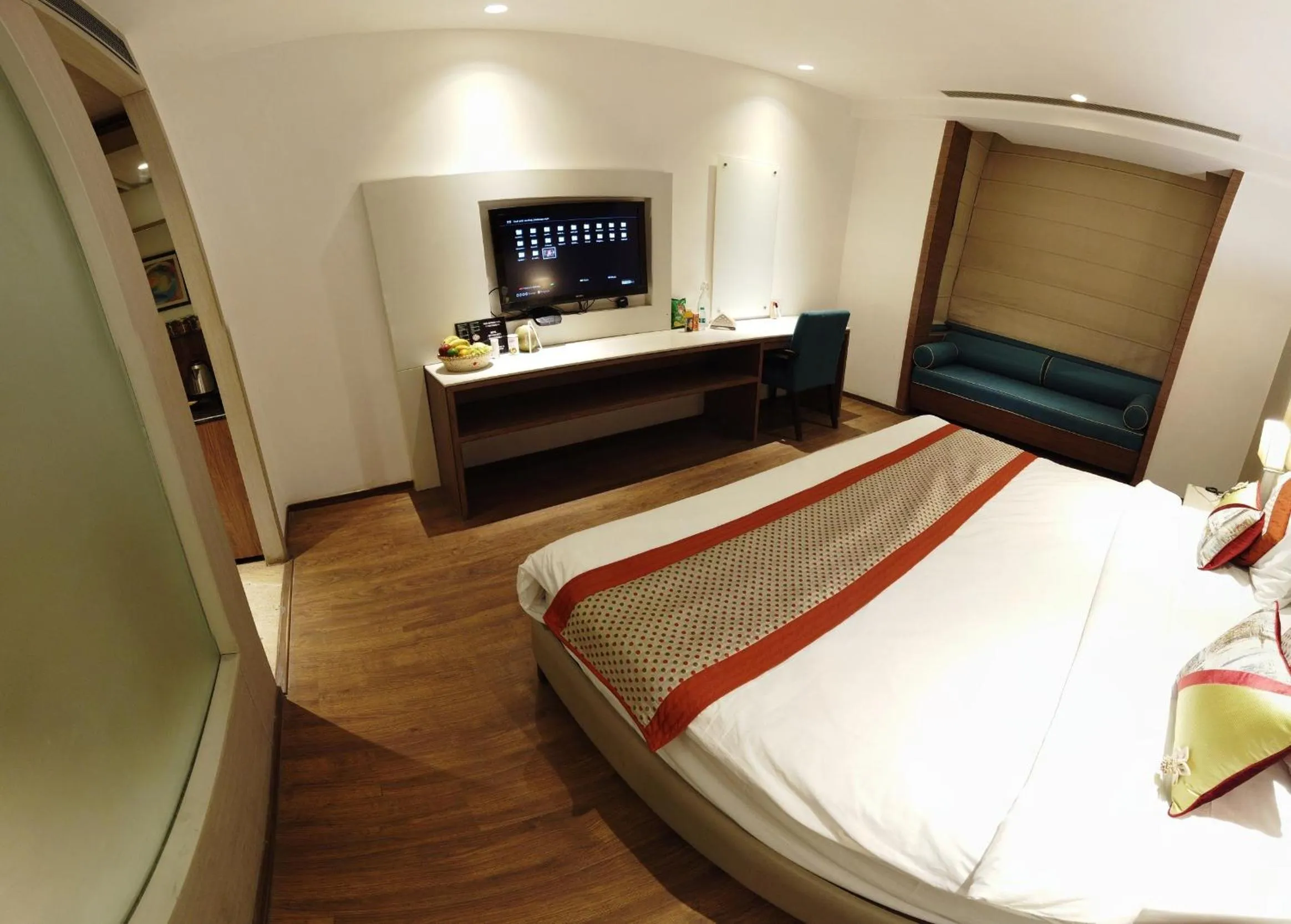 Bed, TV/Entertainment Center in Lemonwood Suites by F9 Hotels - Trivoli Garden Chhatarpur