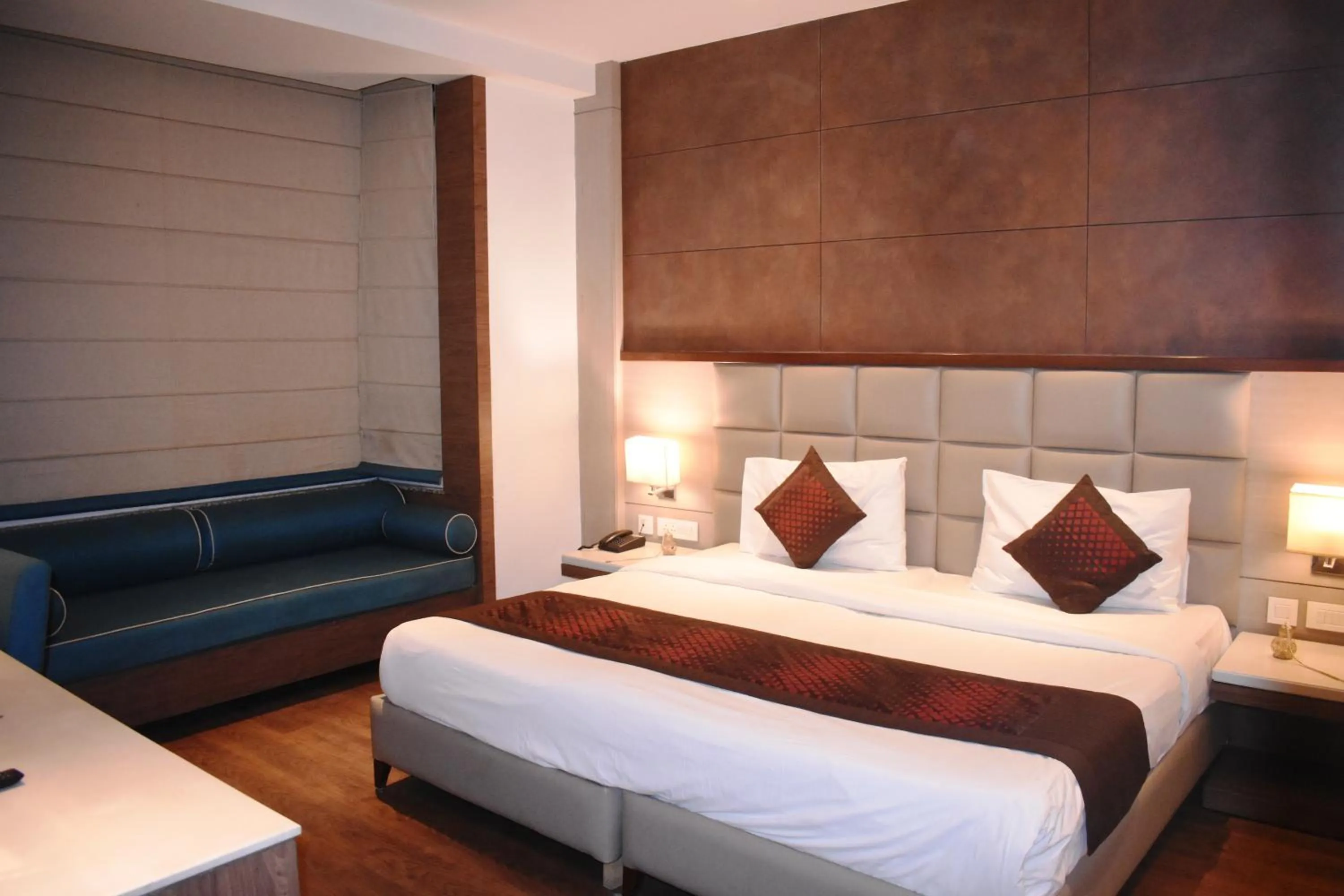 Photo of the whole room, Bed in Lemonwood Suites by F9 Hotels - Trivoli Garden Chhatarpur