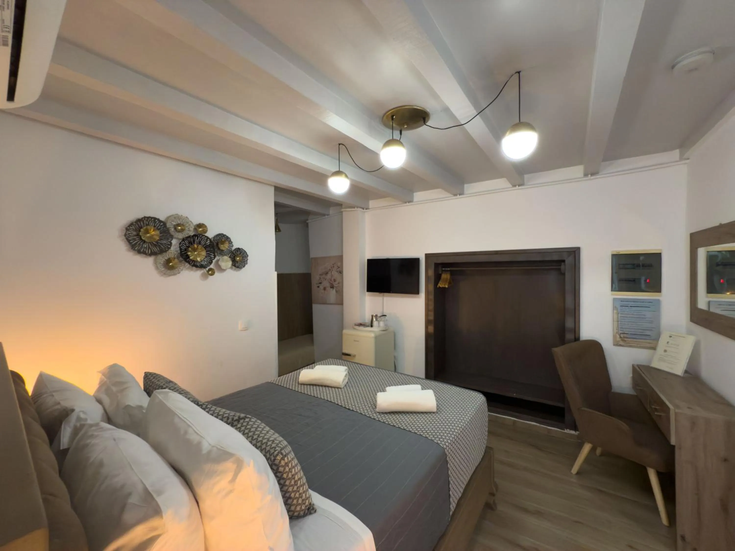 TV and multimedia in Bozzali Deluxe Hotel