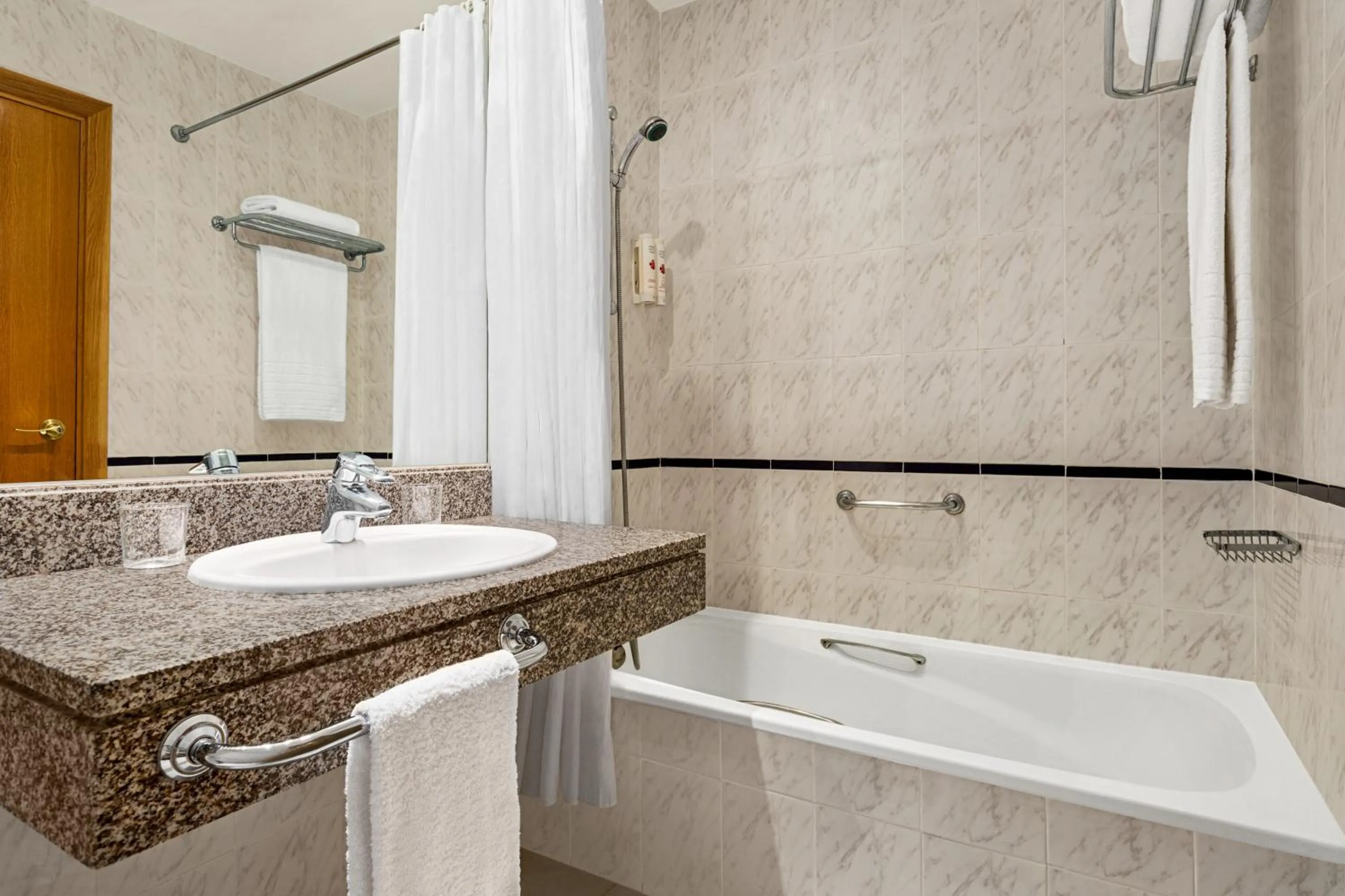 Toilet in Ramada by Wyndham Madrid Tres Cantos