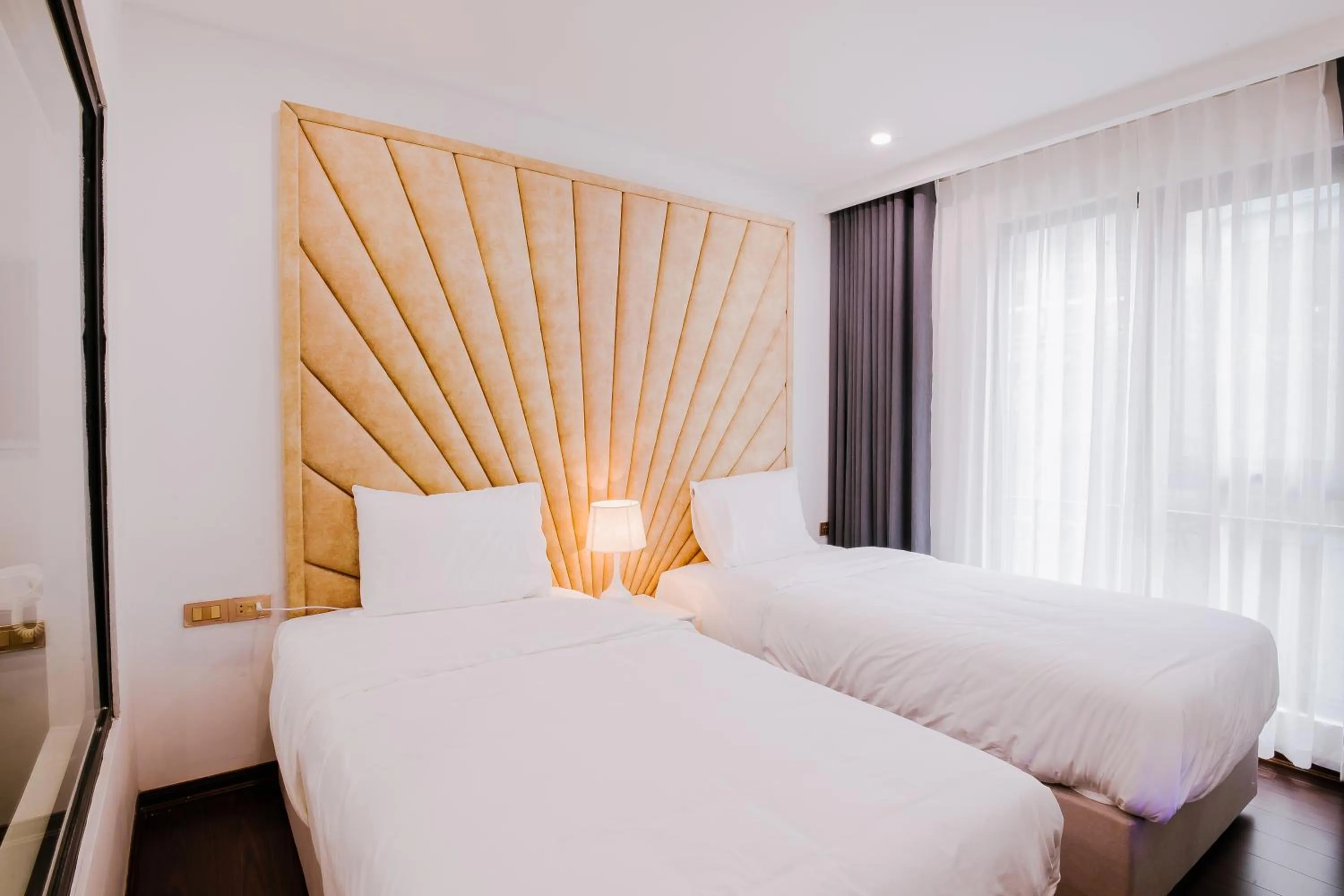 Bed in Royal Lotus Hotel