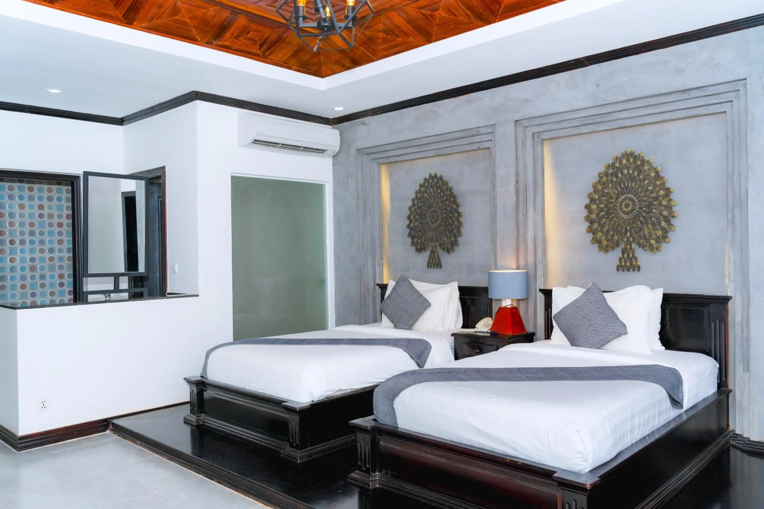 Photo of the whole room, Bed in Angkor Tempora Boutique