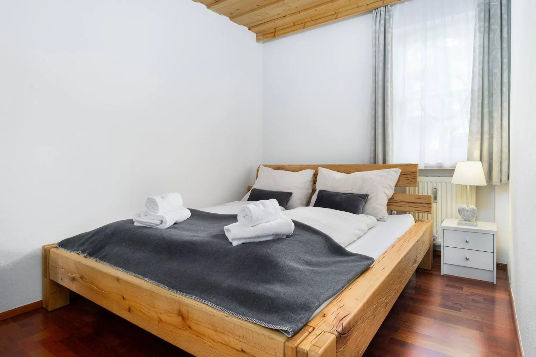 Bed in Kitz-Heart Apartments by Alpine Host Helpers