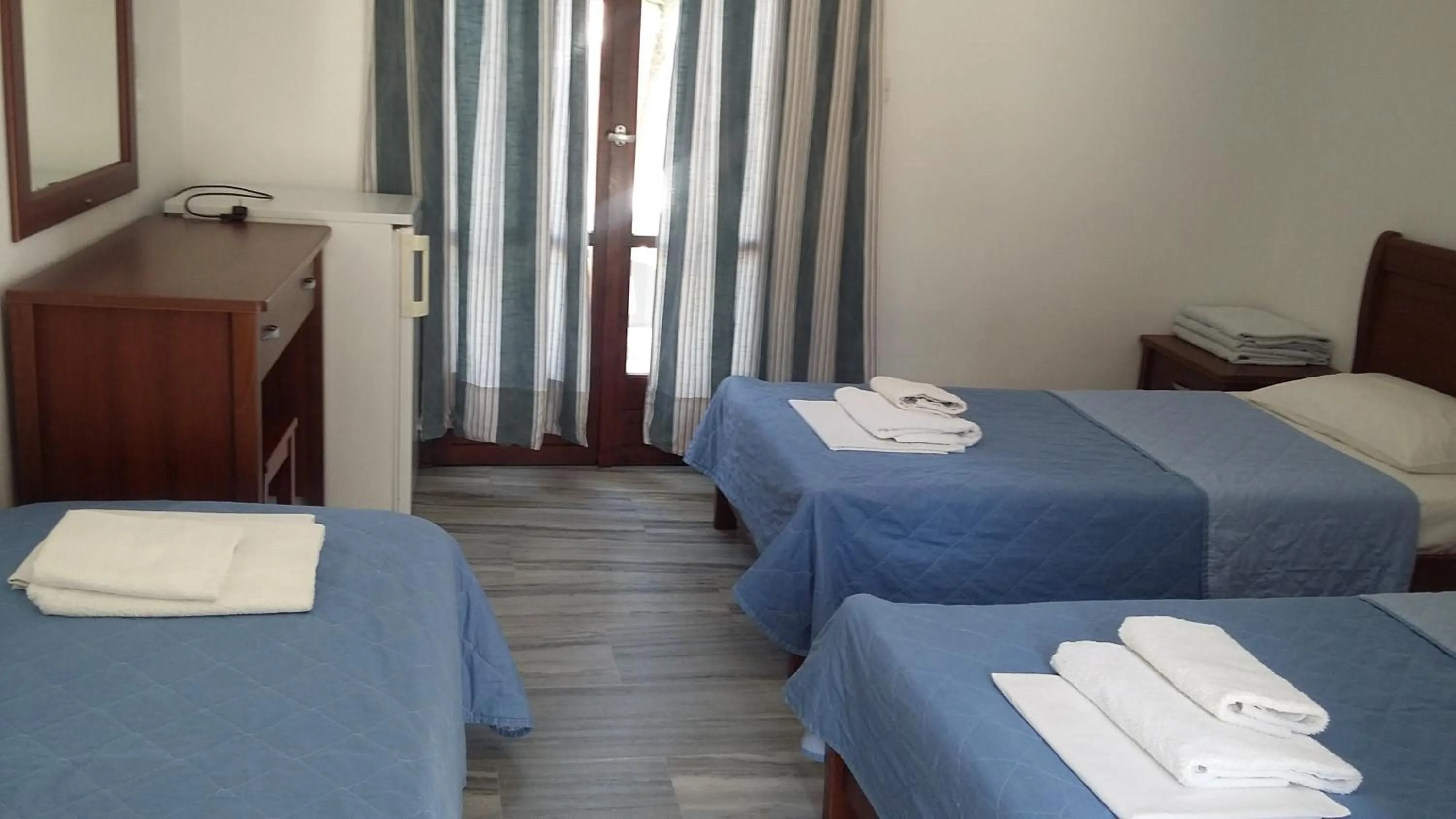 Bed in Rita's Place Hotel