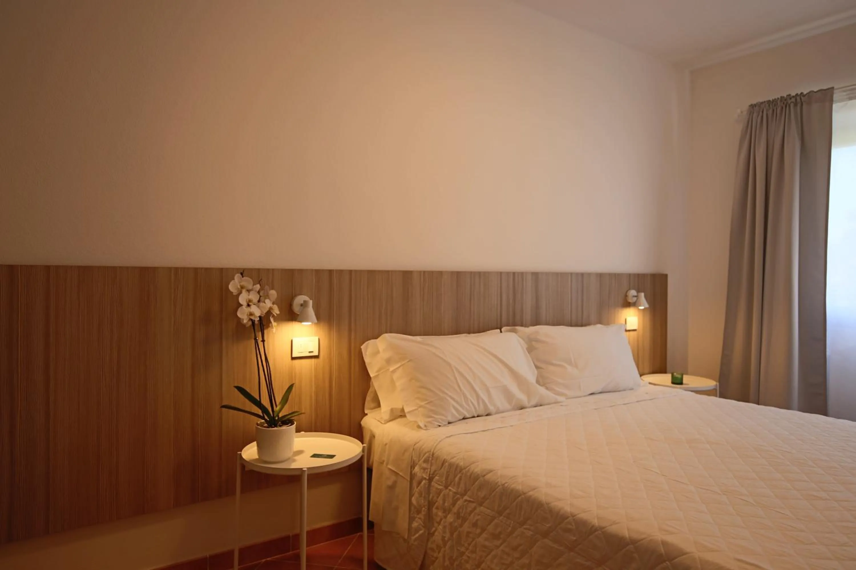 Bed in La Smeraldina Resort