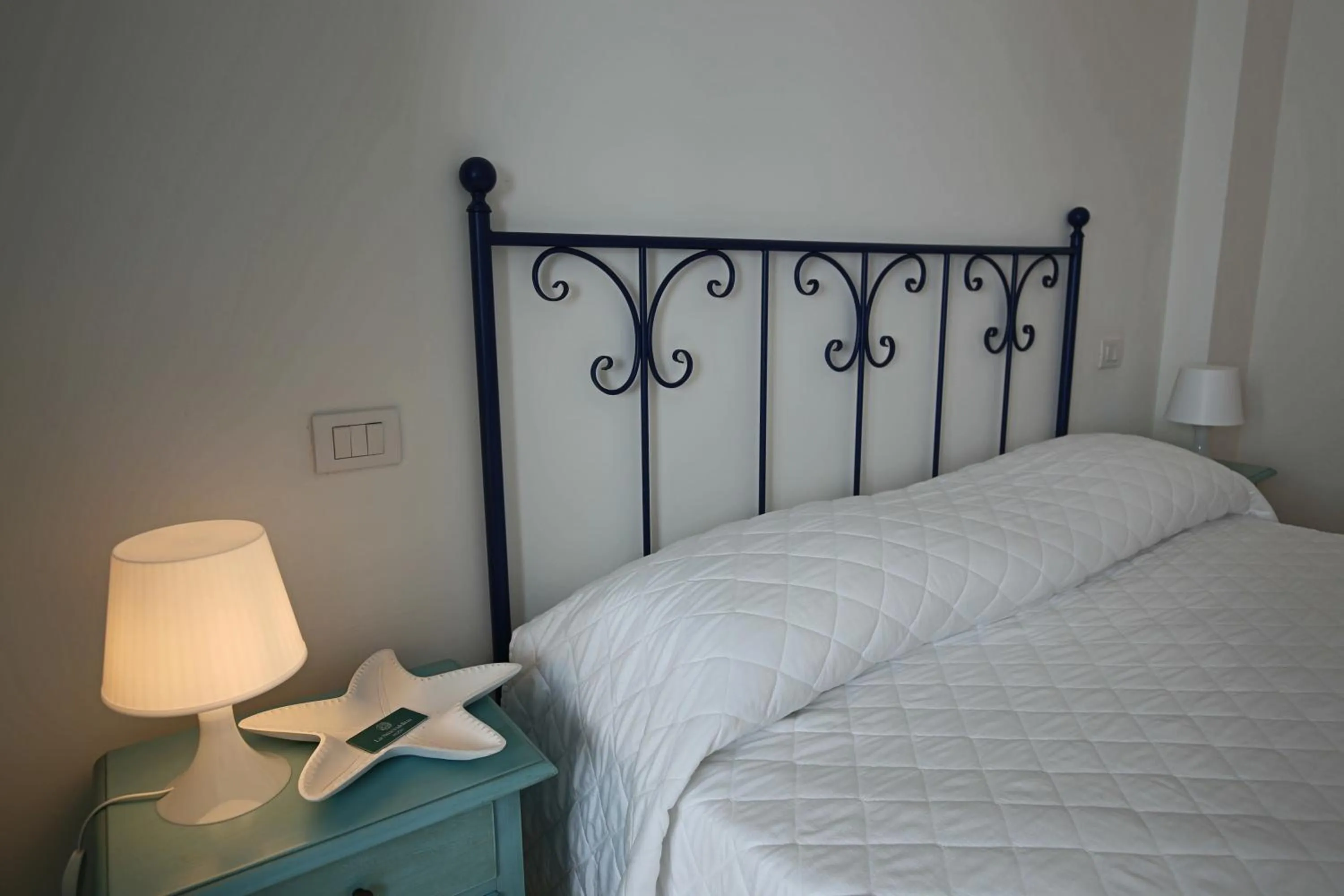 Bed in La Smeraldina Resort