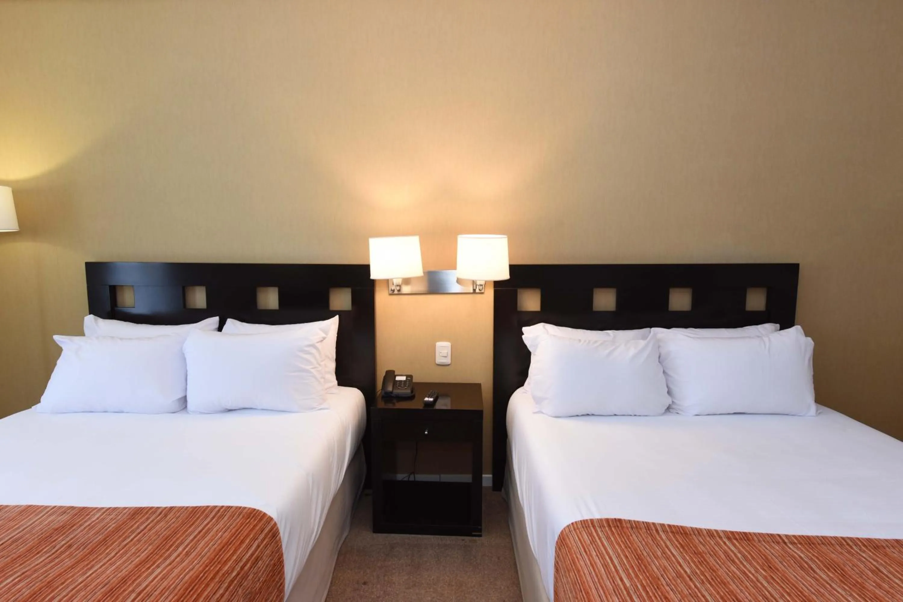 Bed in Camberland Resort & Spa Ramallo