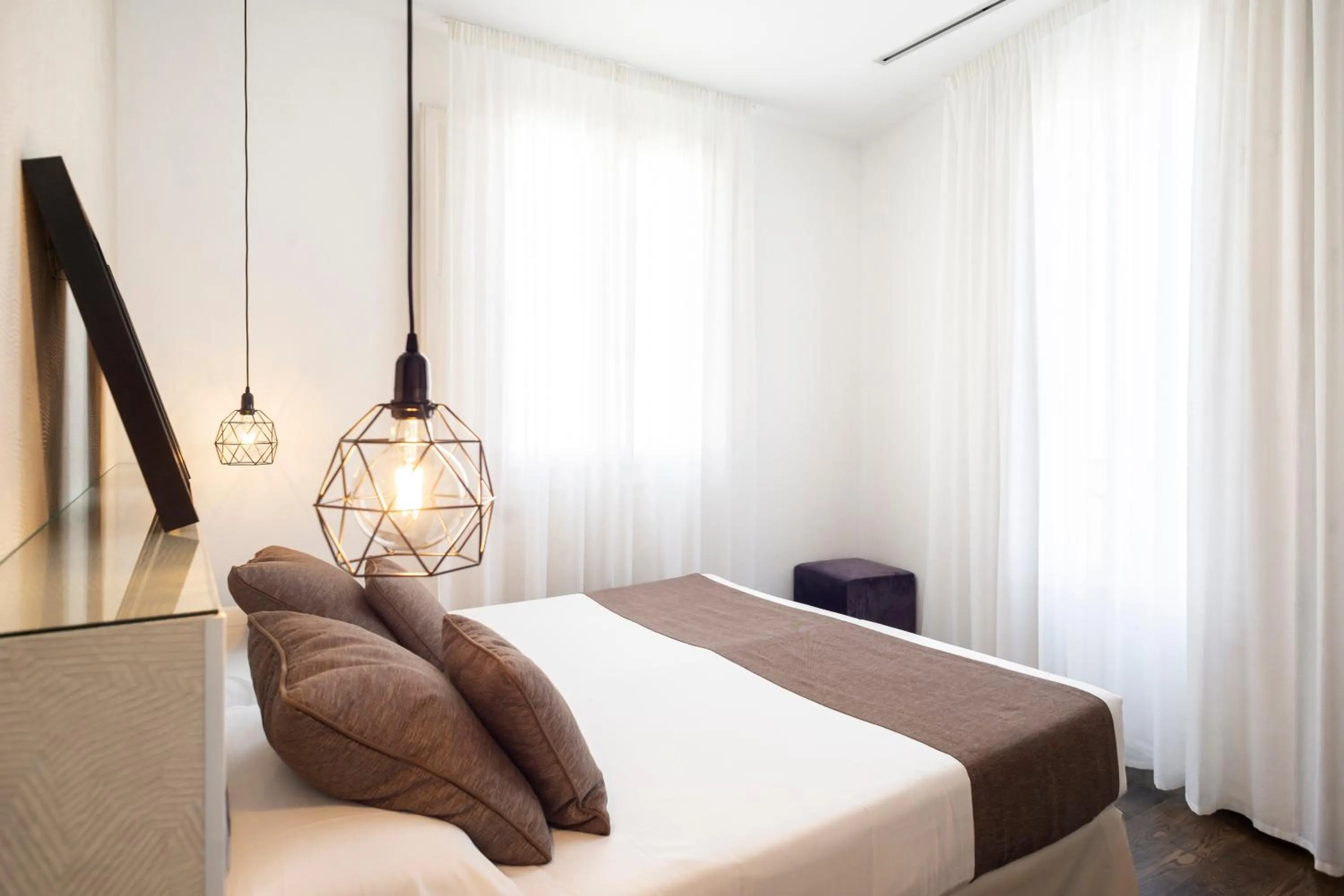 Bed in Blanq Carmen Hotel