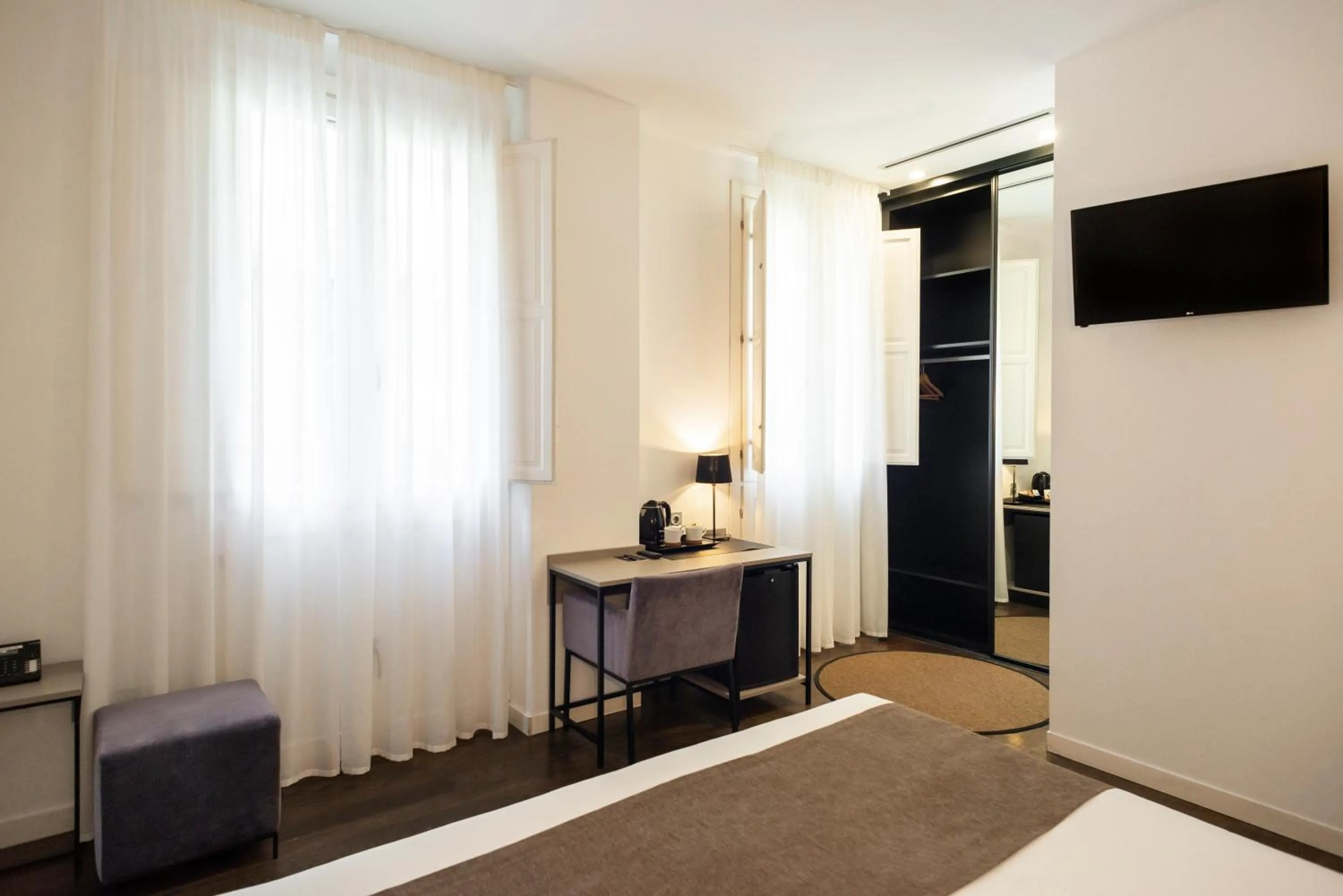 Bed in Blanq Carmen Hotel