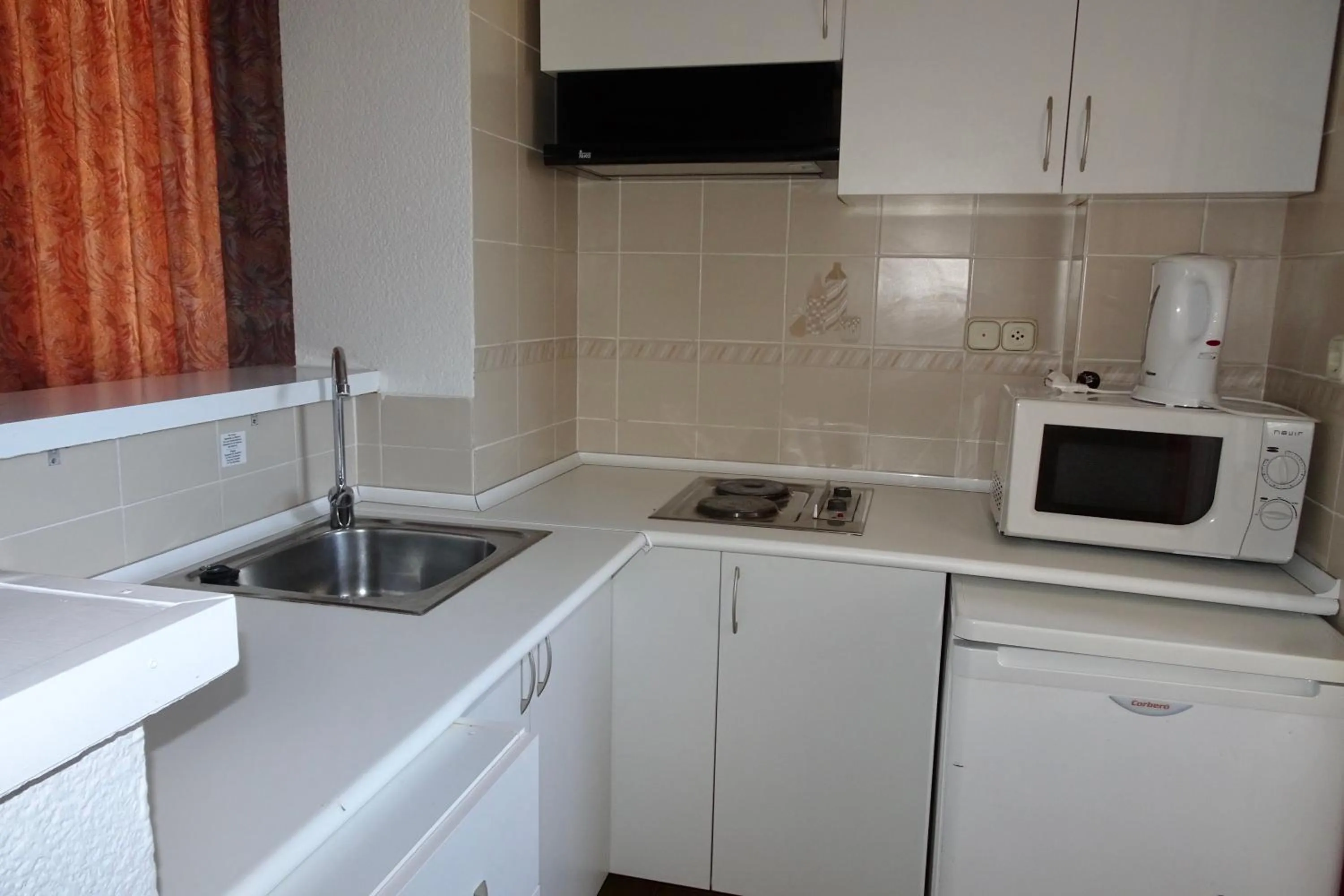 Kitchen or kitchenette in Evamar Apartments