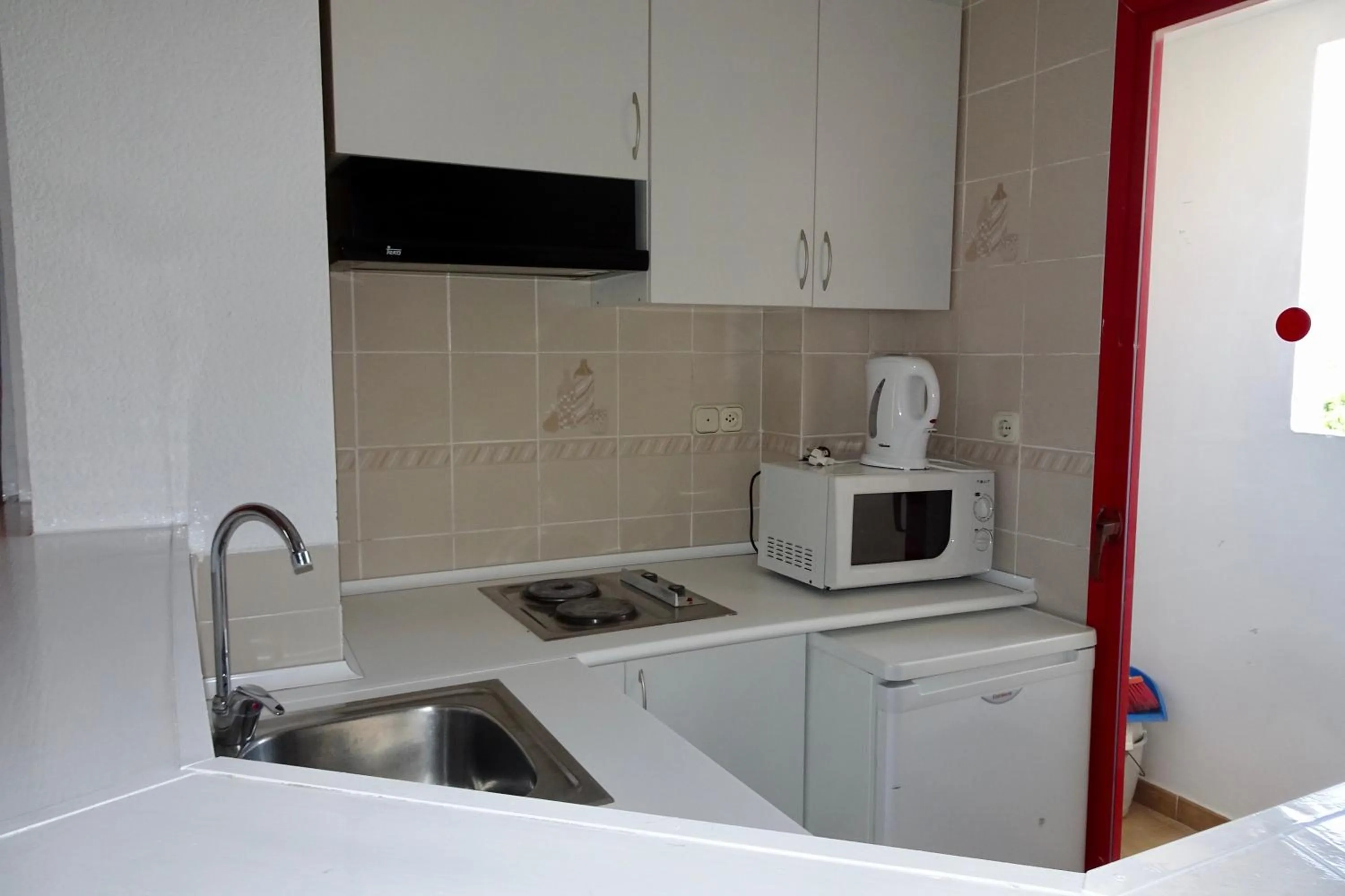 Kitchen or kitchenette in Evamar Apartments