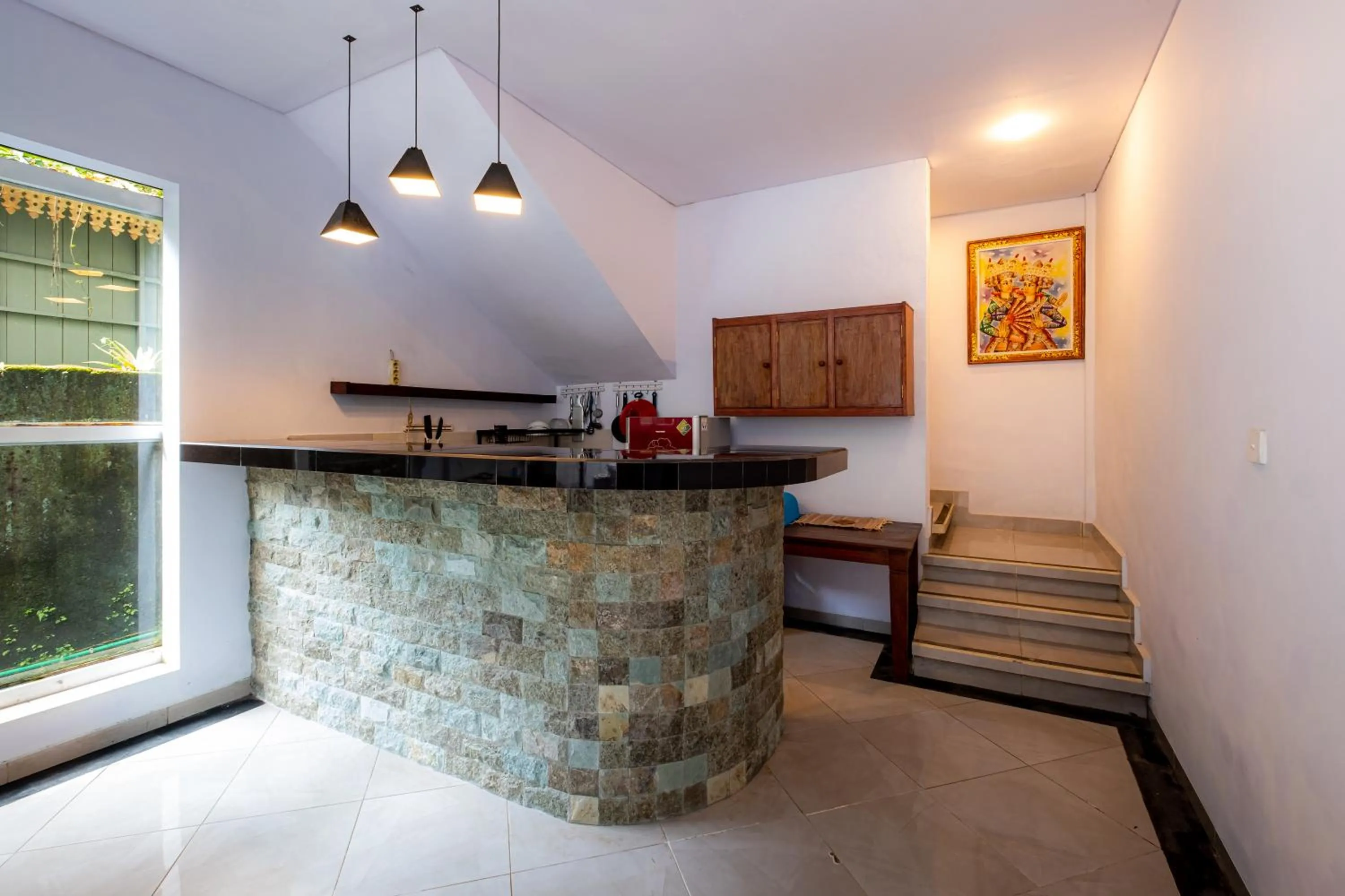 Kitchen or kitchenette in Villa Kubu Arya by Supala