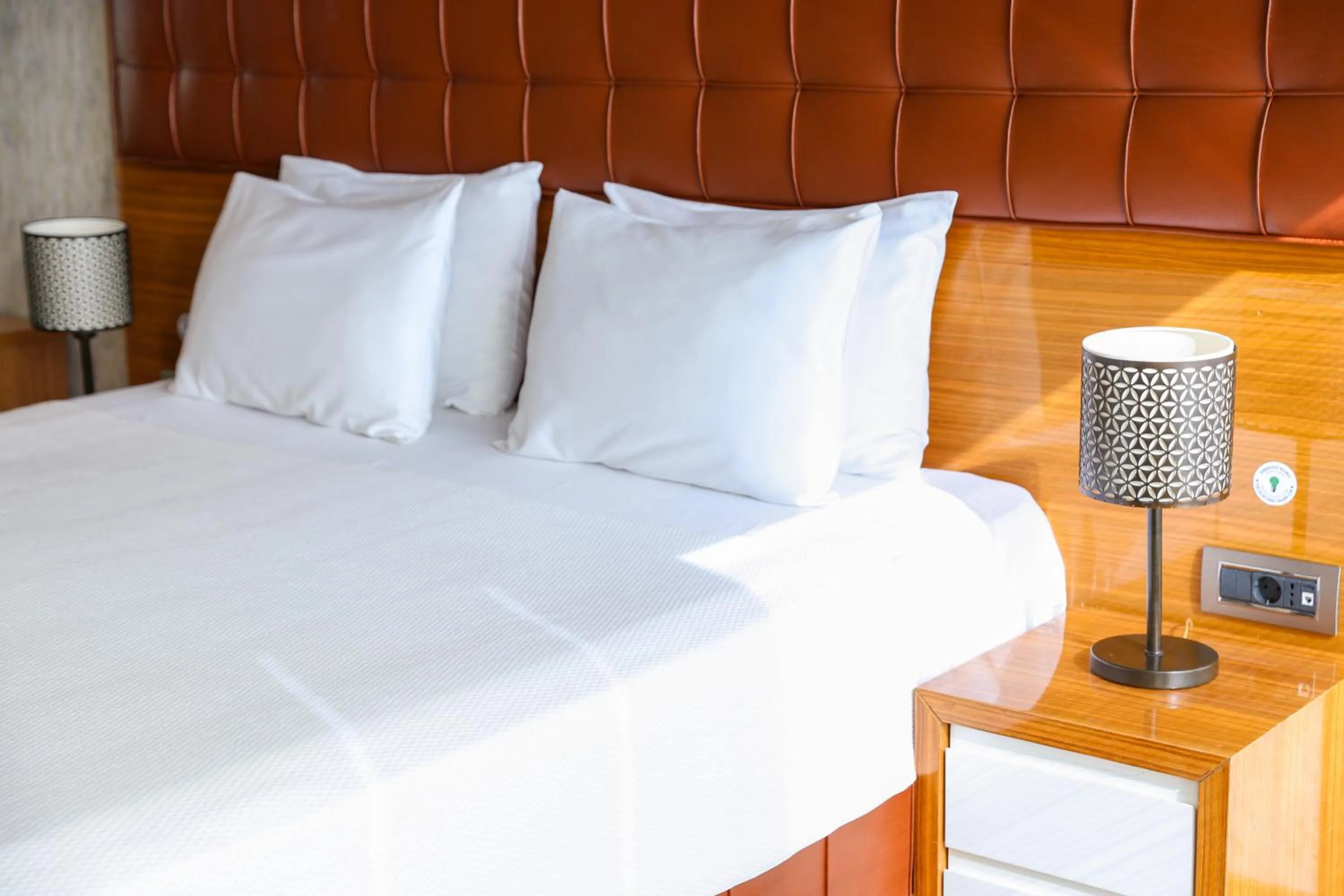 Bed in The Hera Platinum Hotel