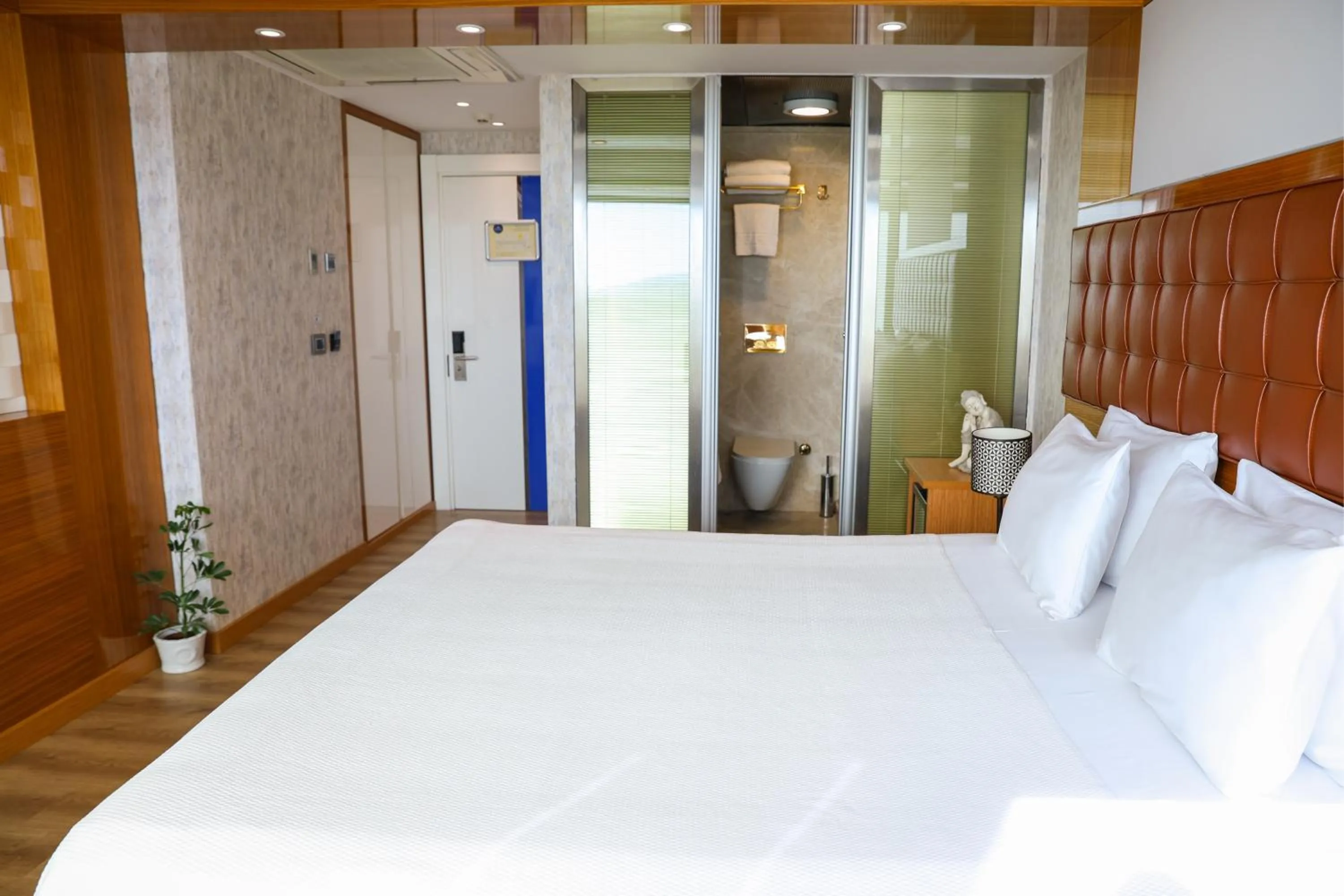 Bed in The Hera Platinum Hotel