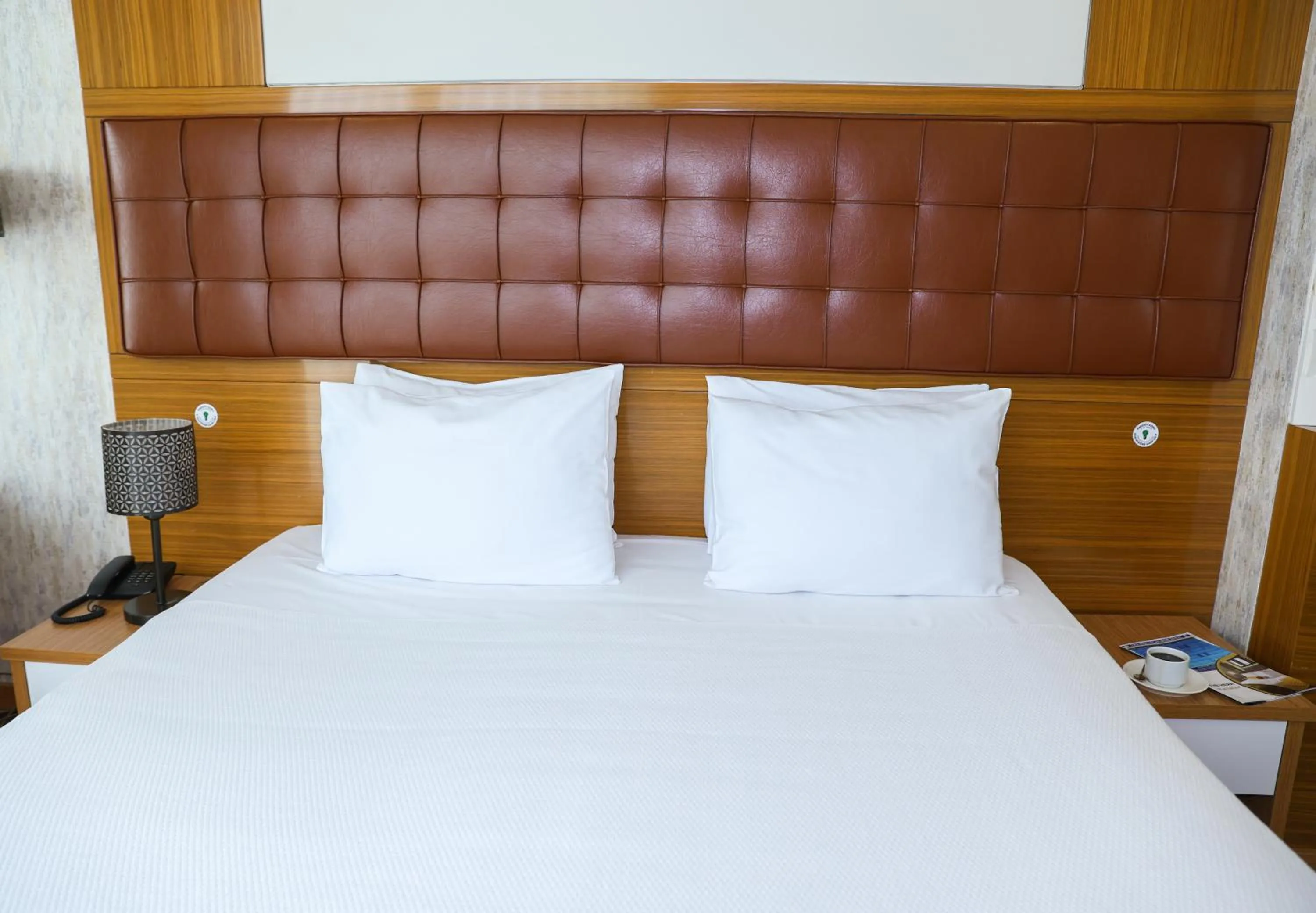 Bed in The Hera Platinum Hotel