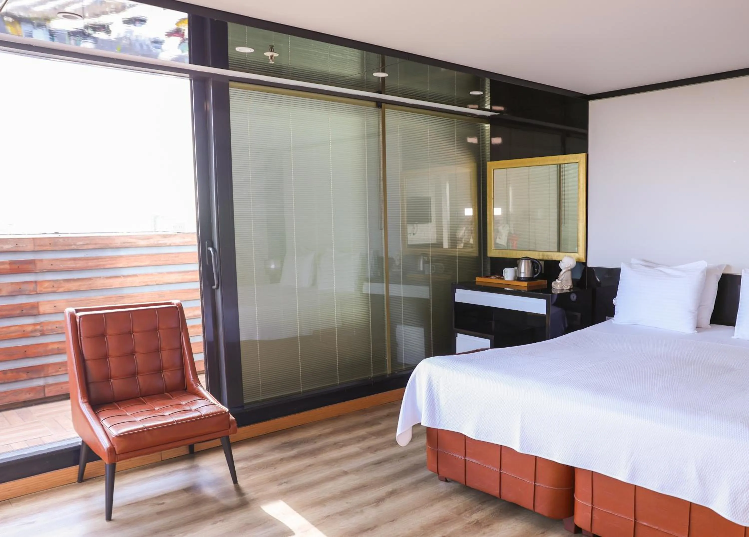 Bed in The Hera Platinum Hotel