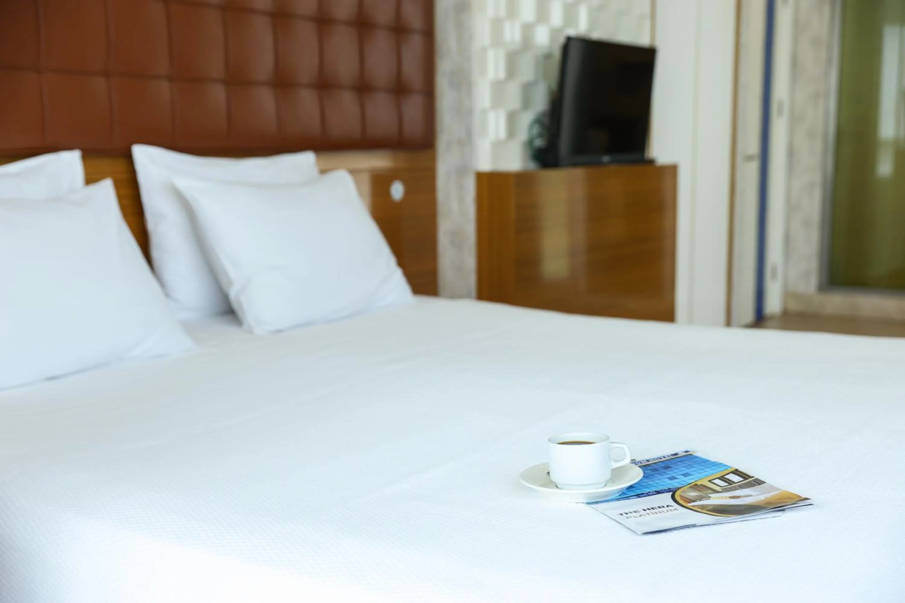 Bed in The Hera Platinum Hotel