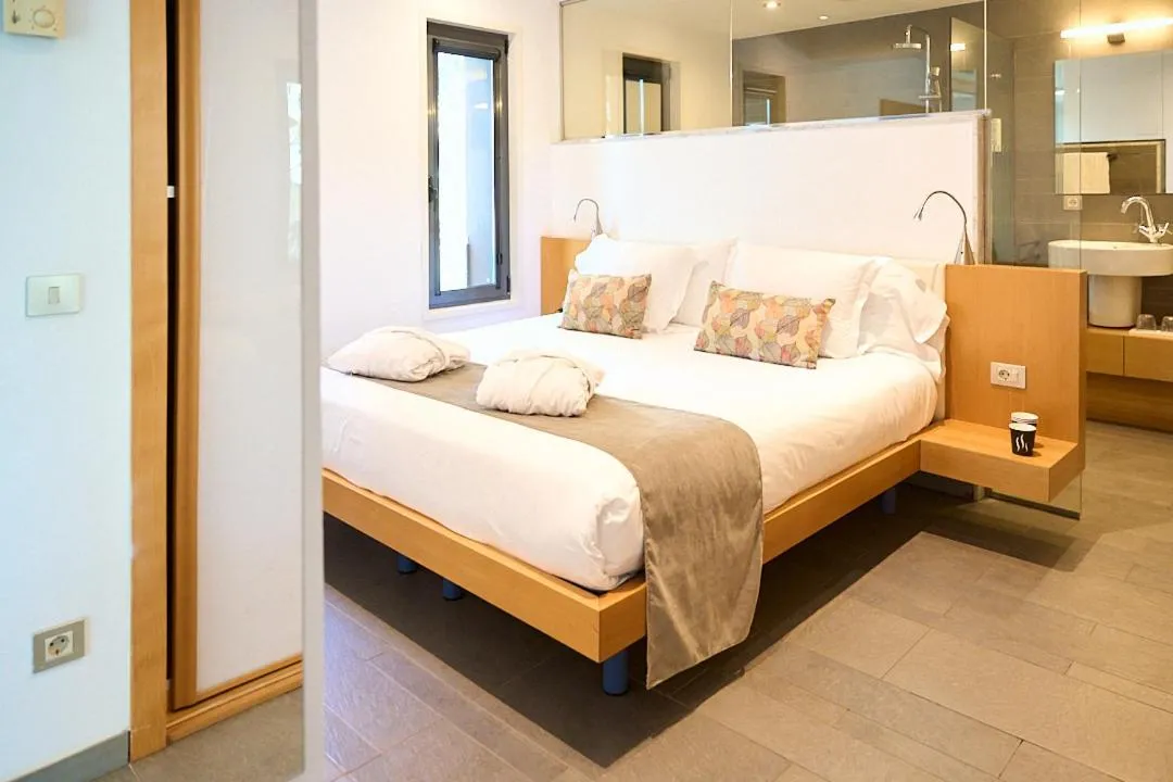 Bed in NM Suites by Escampa Hotels