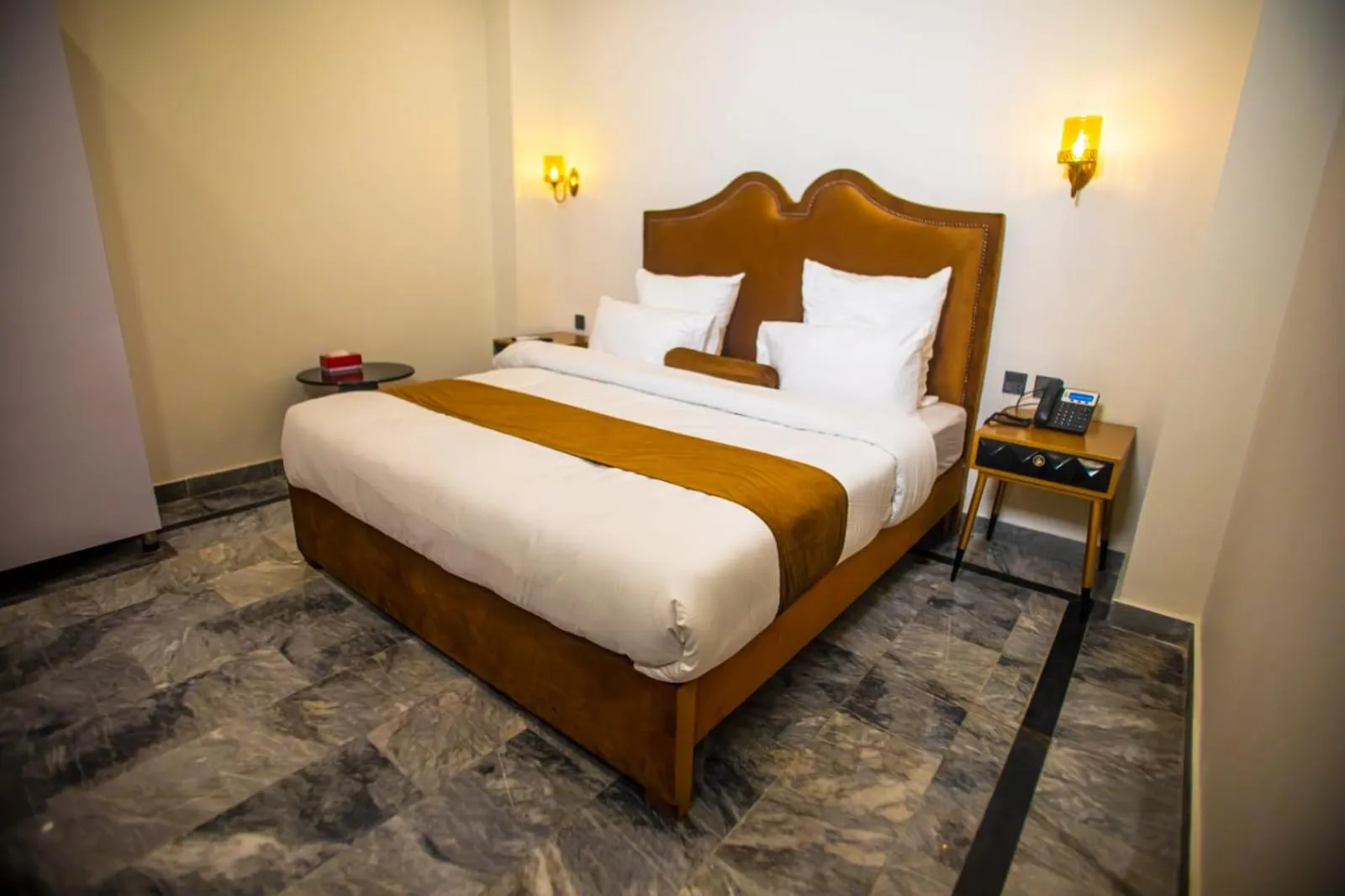 Bed in The Rich Hotel & Apartments