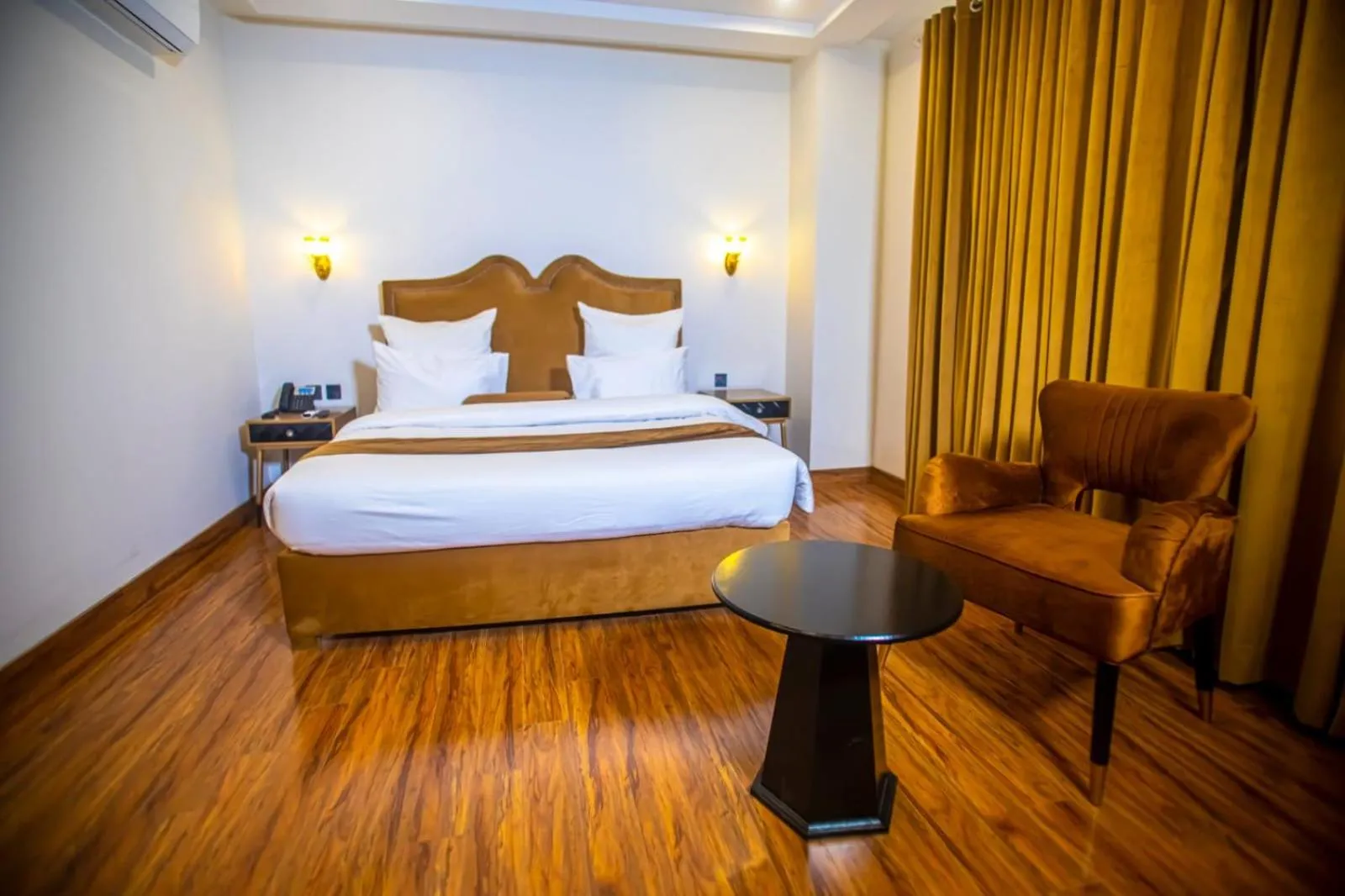 Bed in The Rich Hotel & Apartments