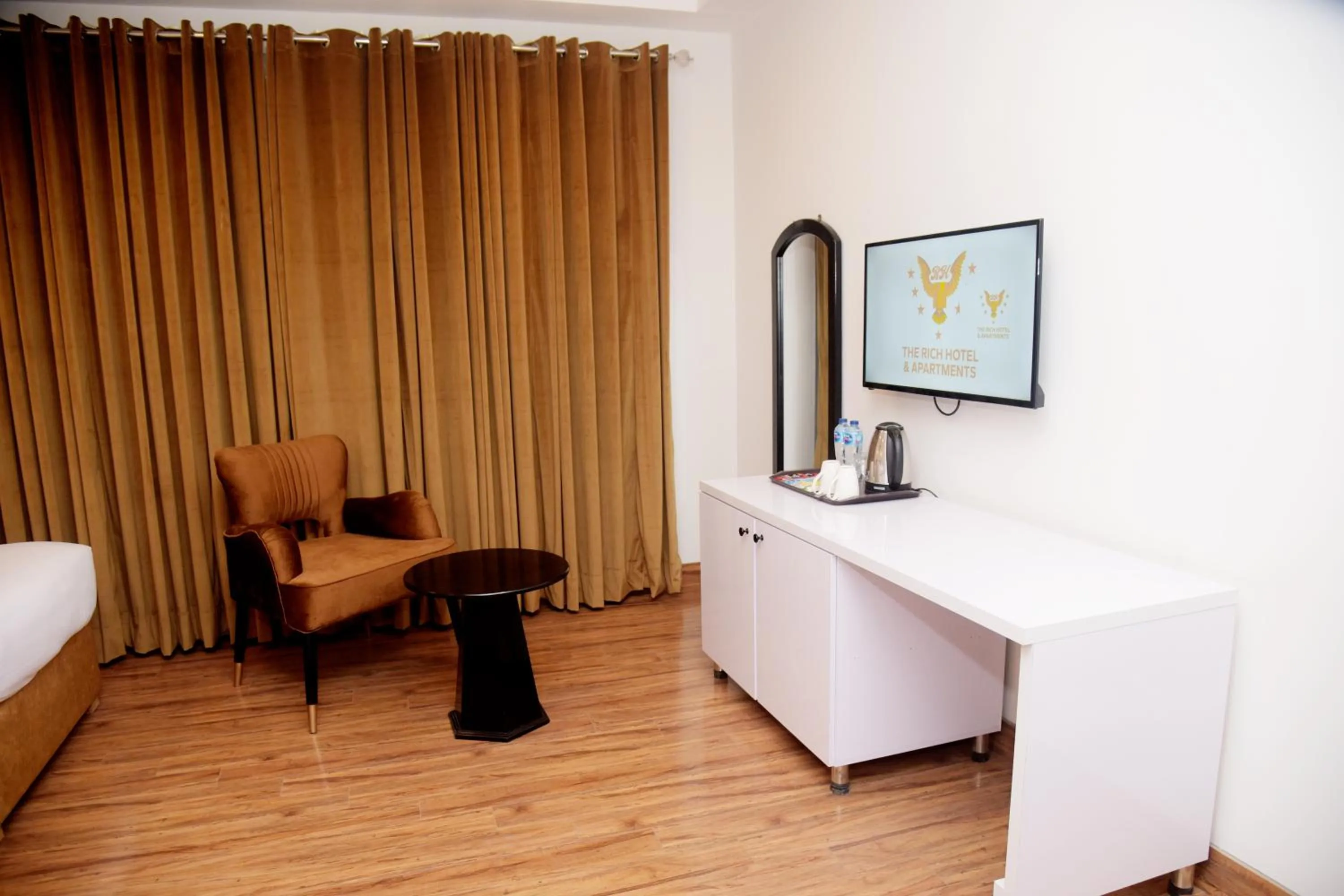 Bed in The Rich Hotel & Apartments