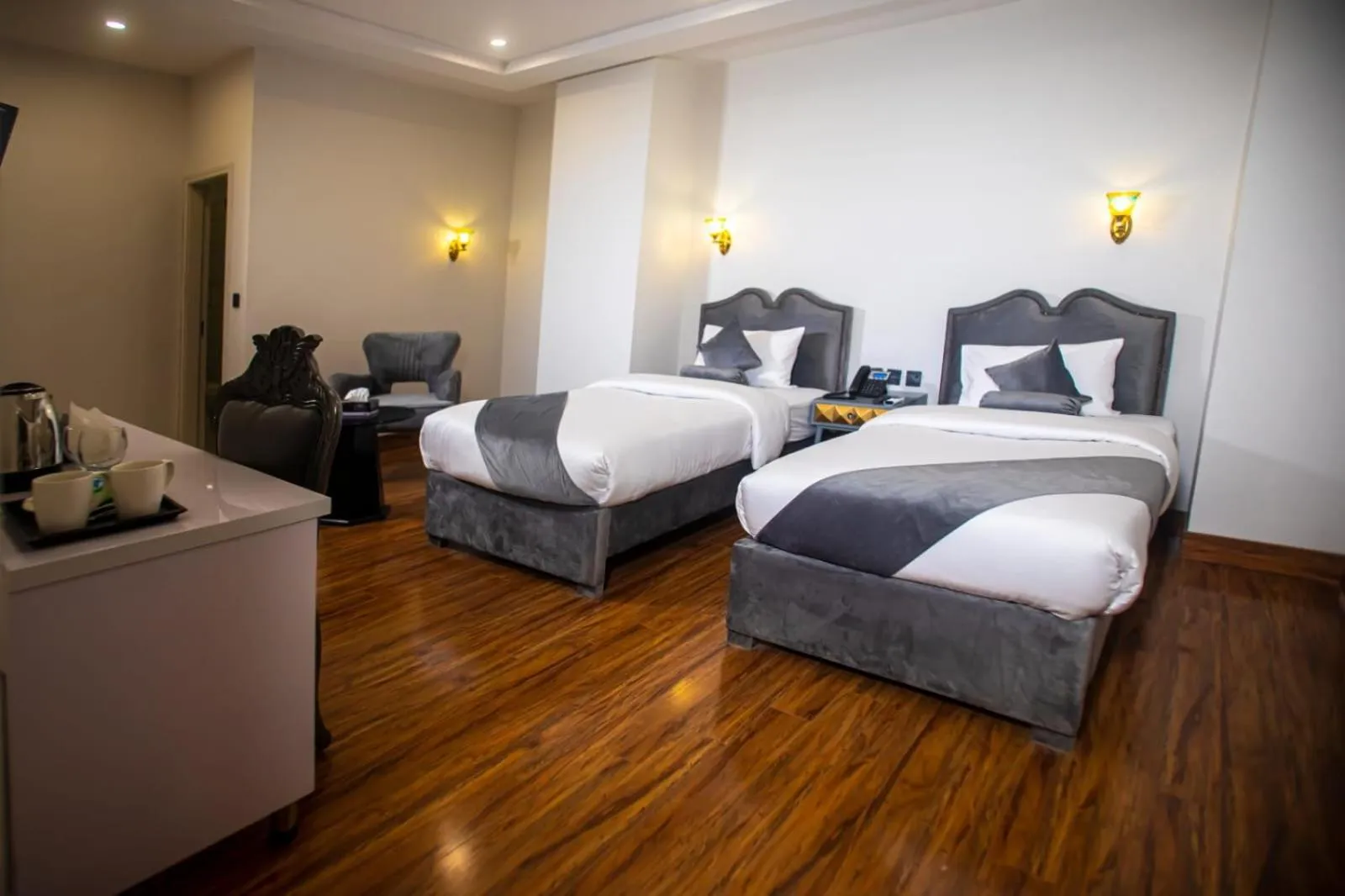 Bed in The Rich Hotel & Apartments