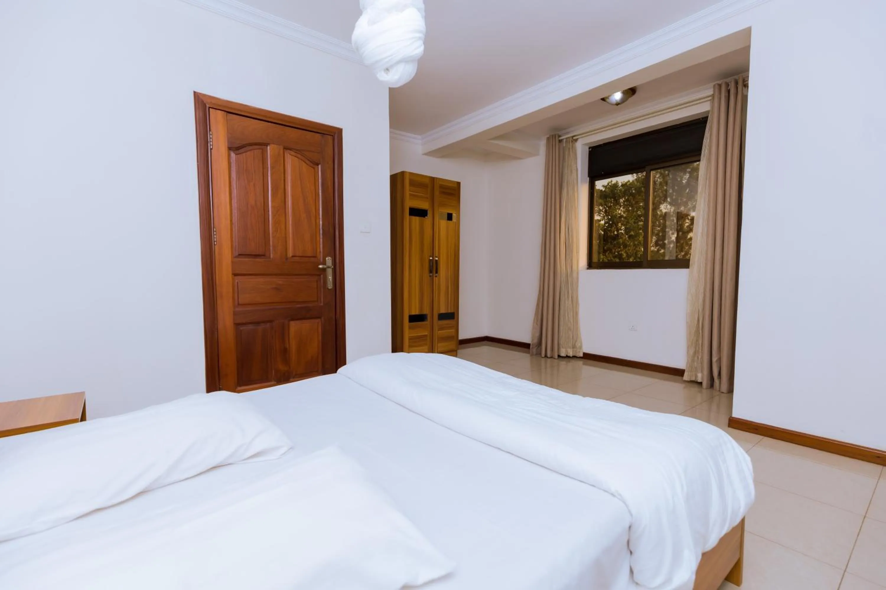 Bed in KAMI LUXURY APARTMENTS