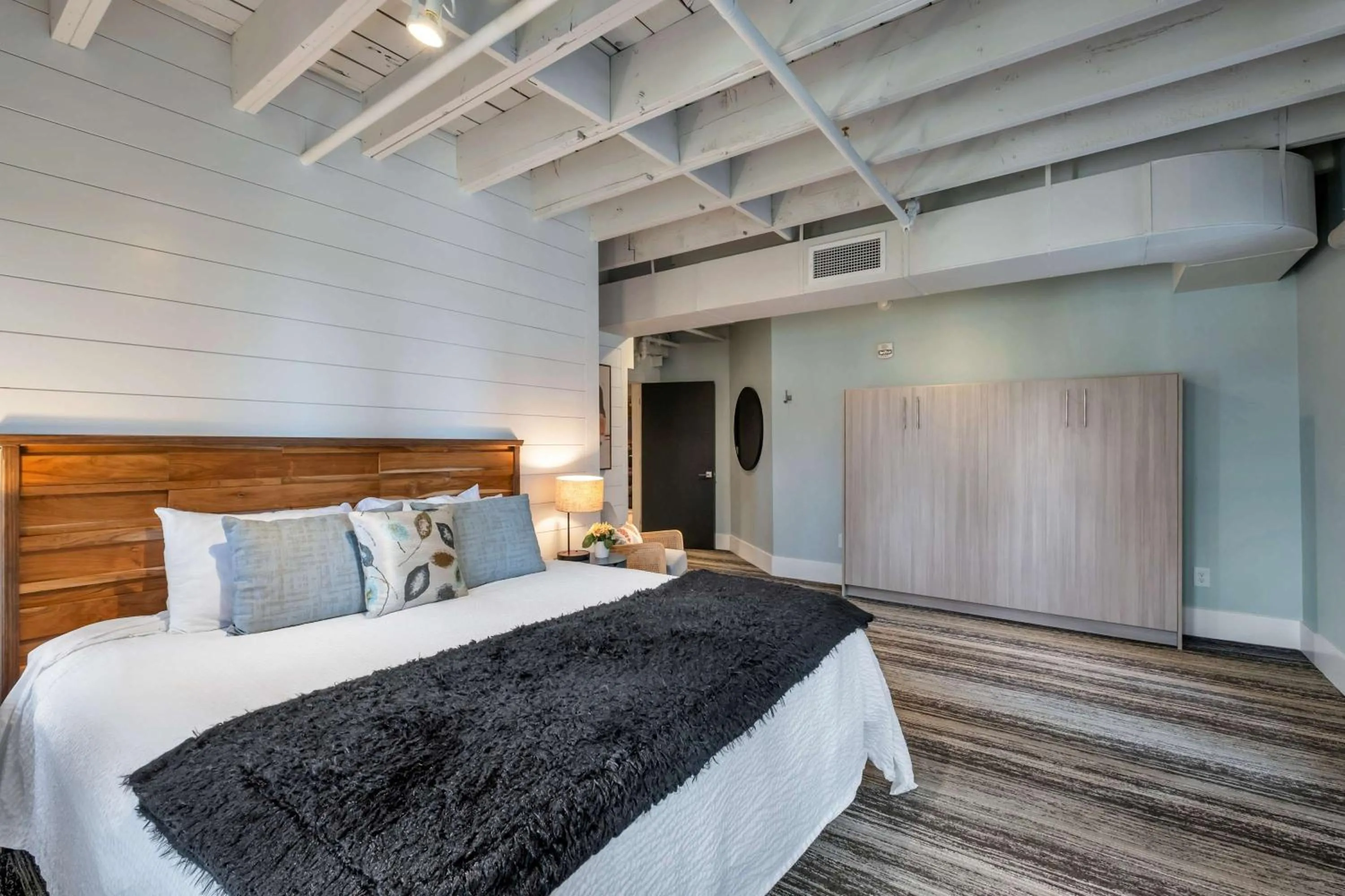 Bed in Skyline Suite with Penthouse & Rooftop Deck 6BR by Maddox Hotel