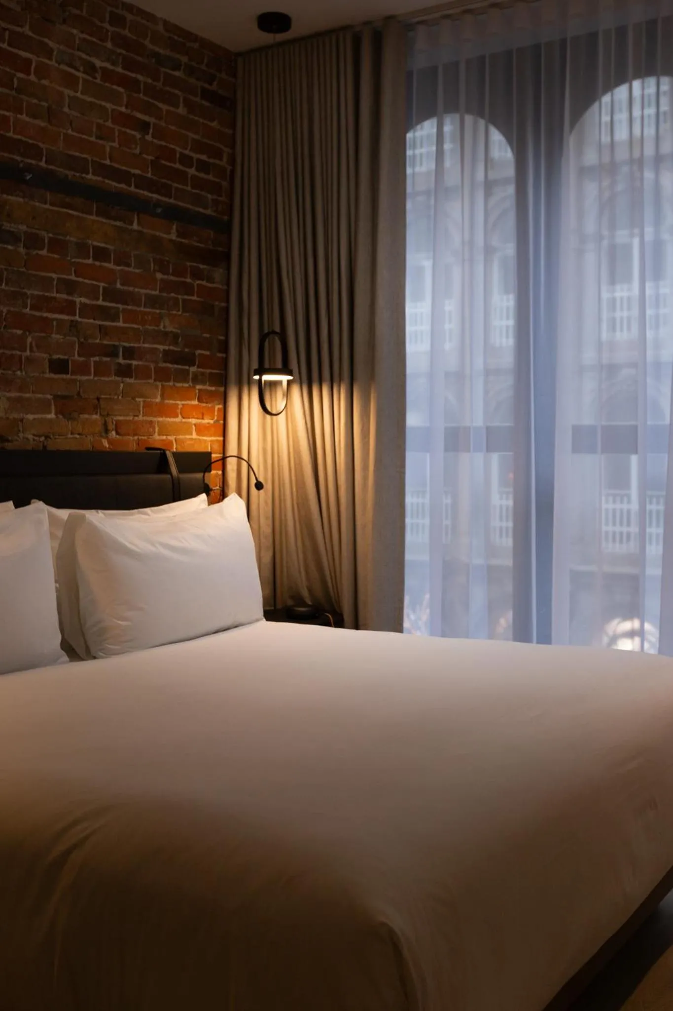 Bed in Le Petit Hotel Notre Dame