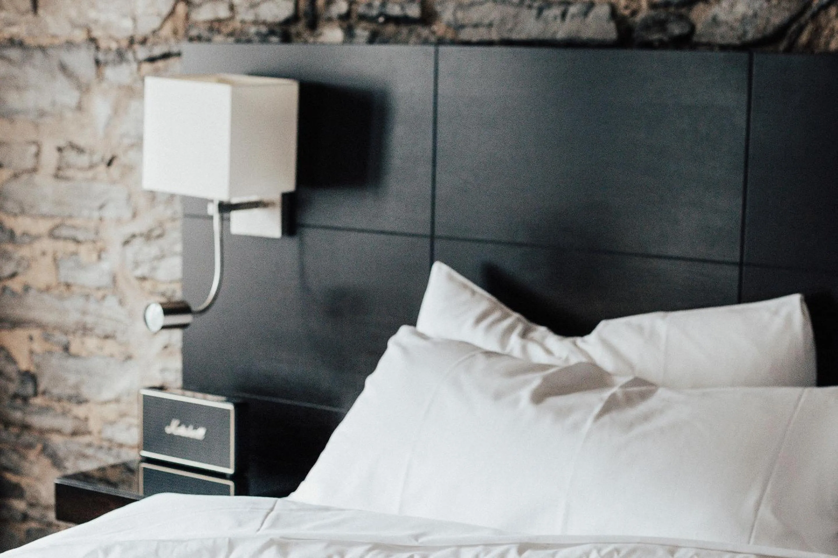 Bed in Le Petit Hotel Notre Dame