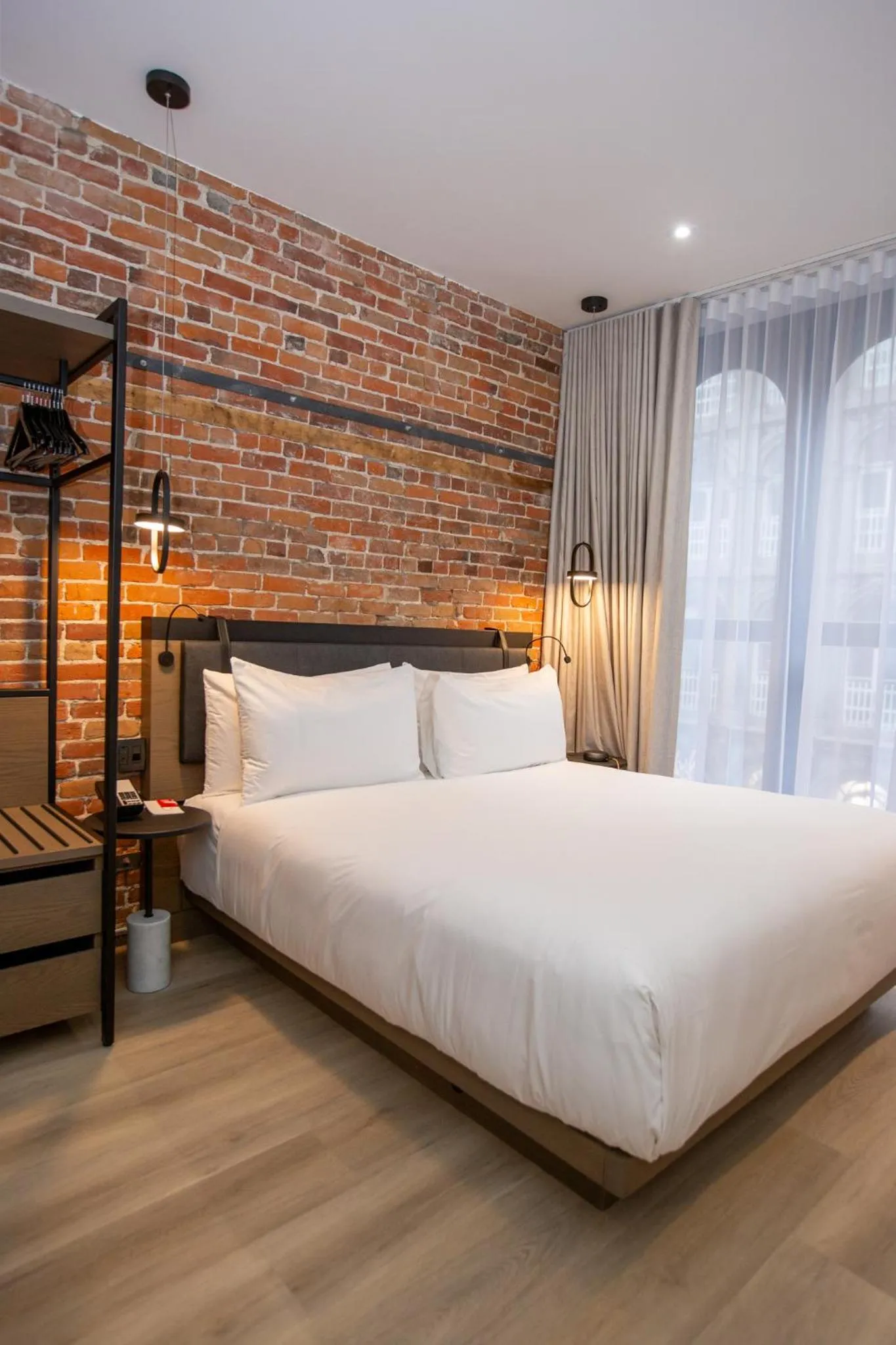 Bed in Le Petit Hotel Notre Dame