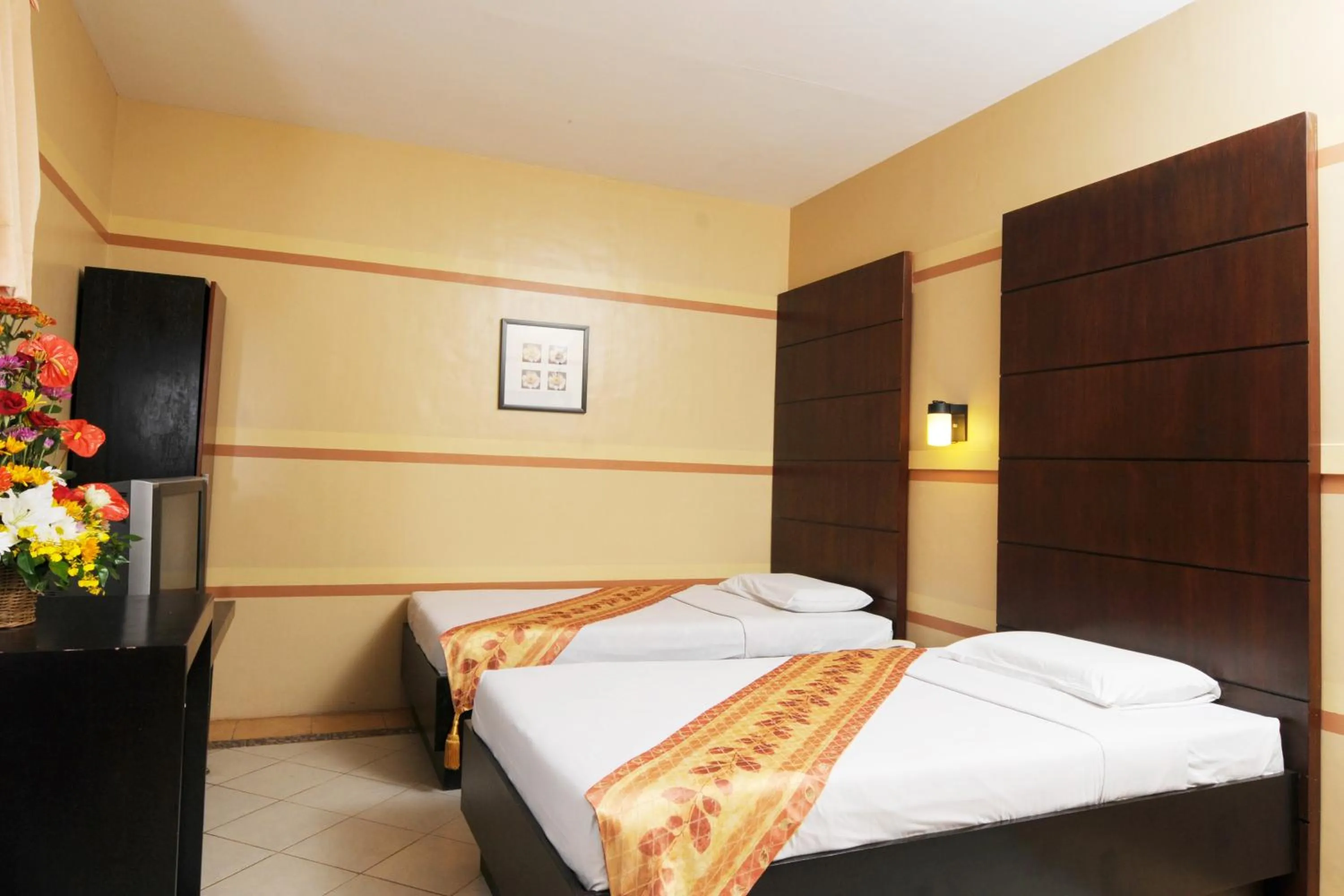 Bed in Sampaguita Suites JRG