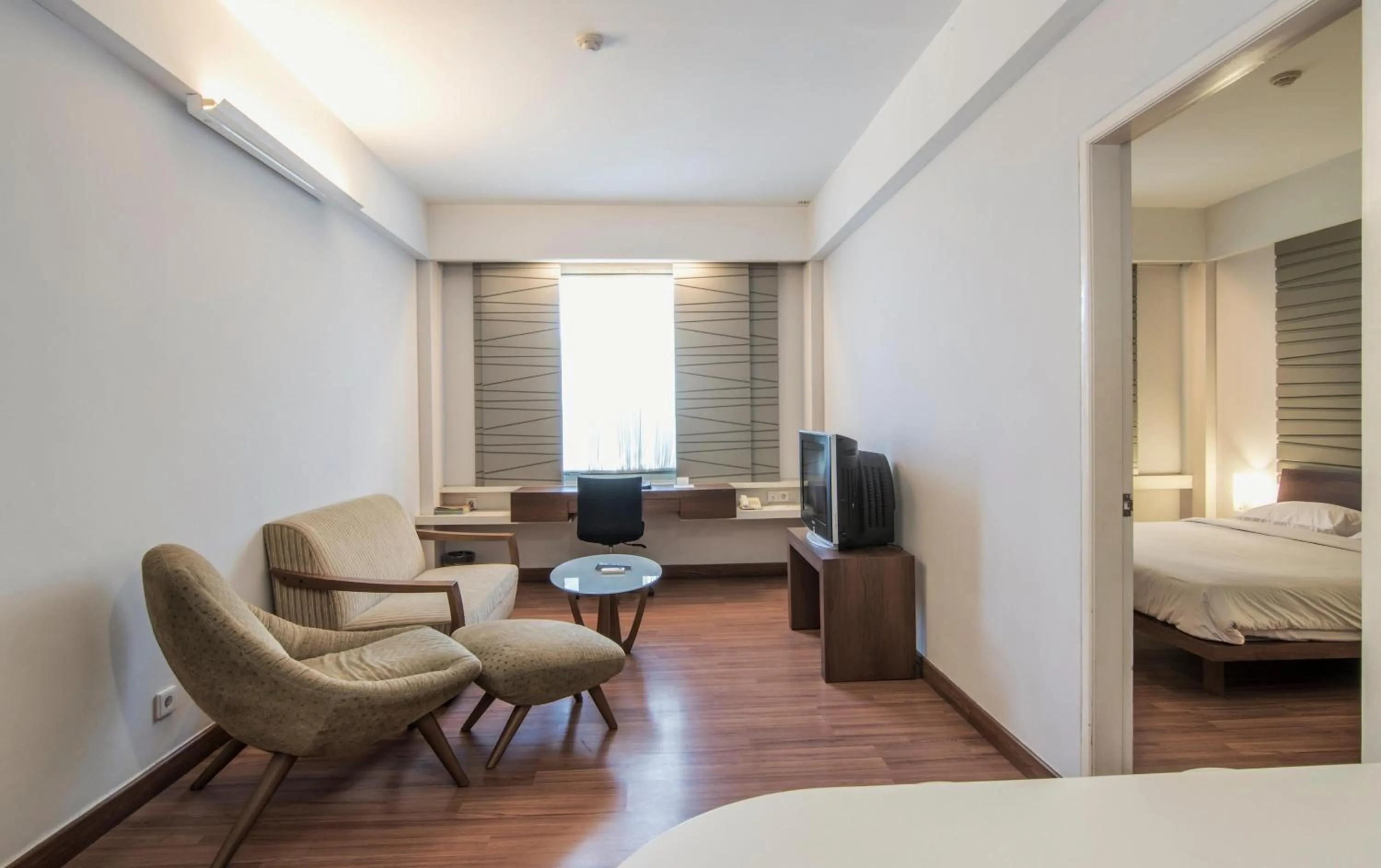Living room, Bed in Grand Cikarang Hotel
