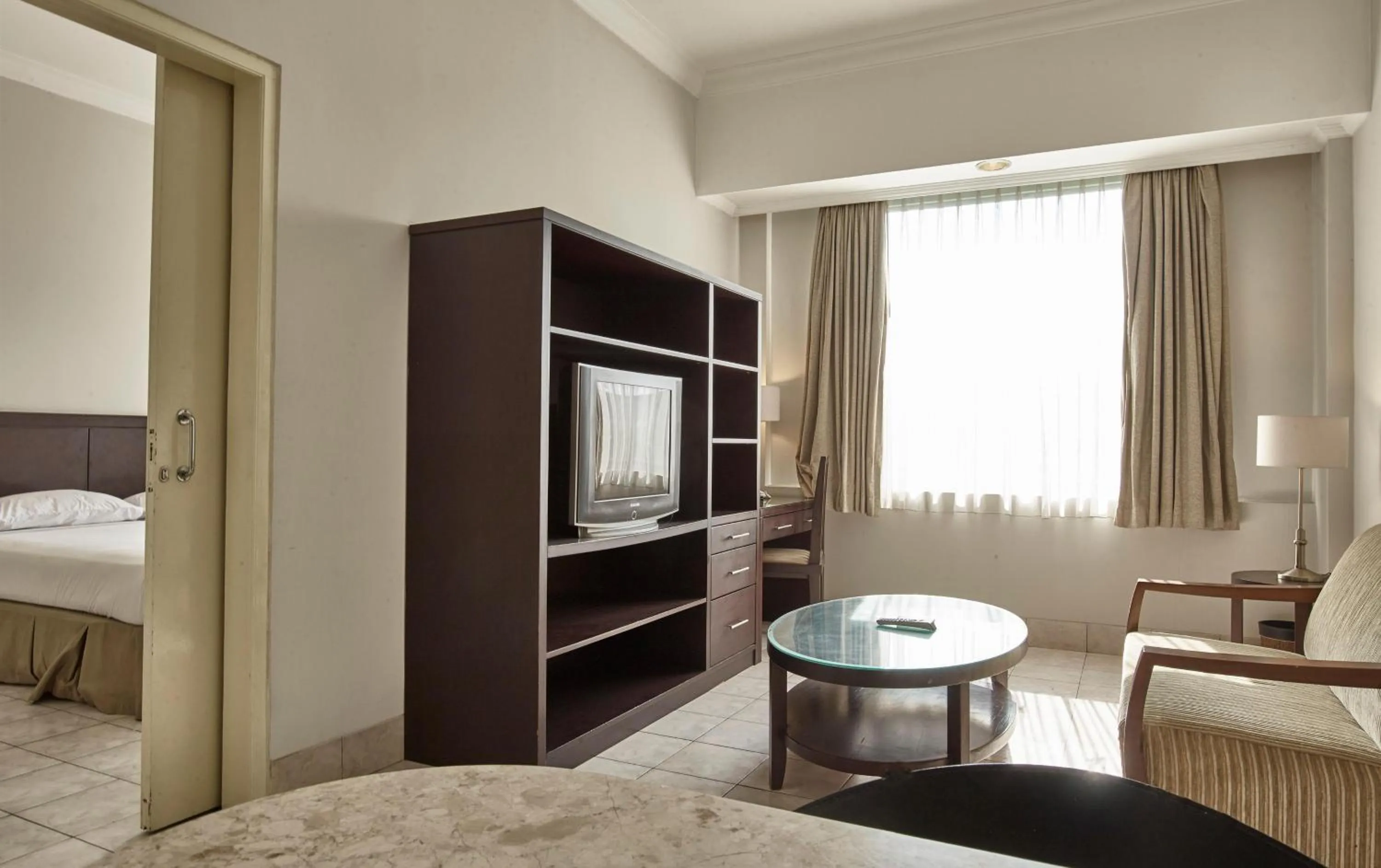 Living room, Bed in Grand Cikarang Hotel