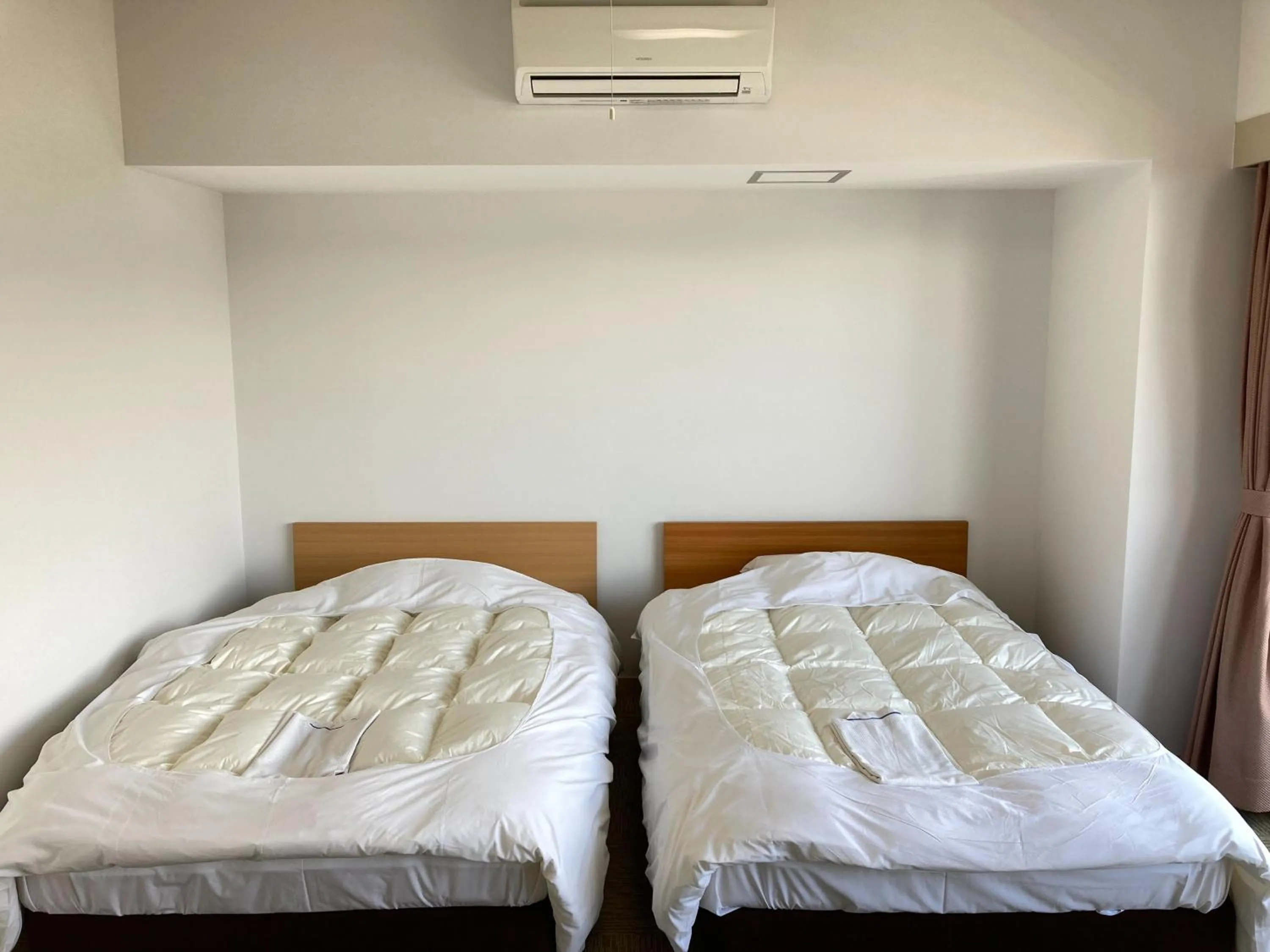 Bed in Chateraise Lodge Kasugai