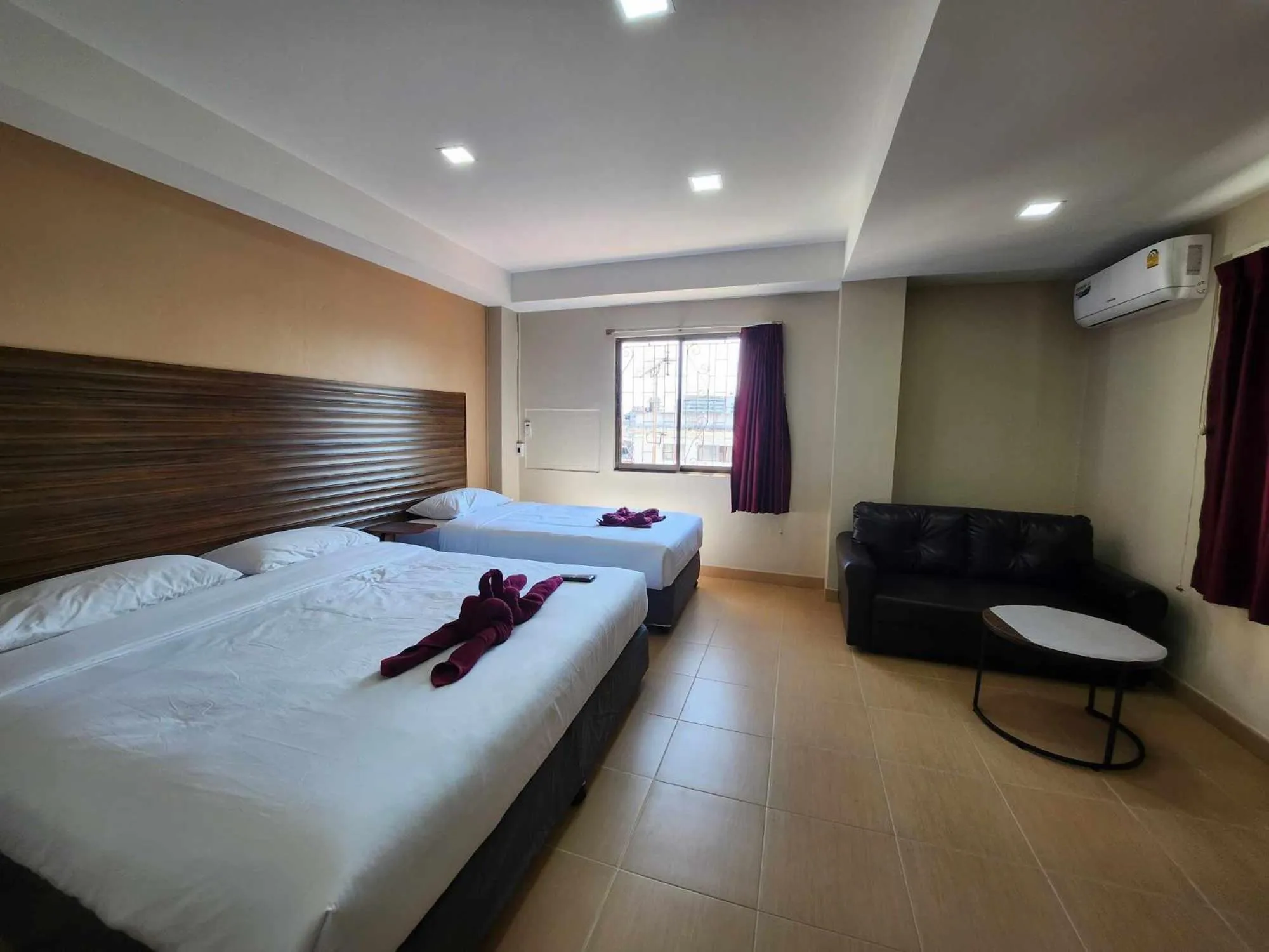 Bed in White Rose​ Hotel​ II​