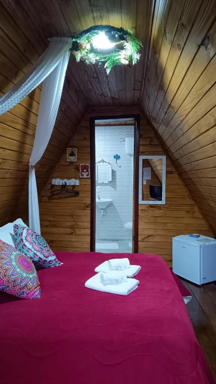 Bed in Pousada Bosque do Visconde