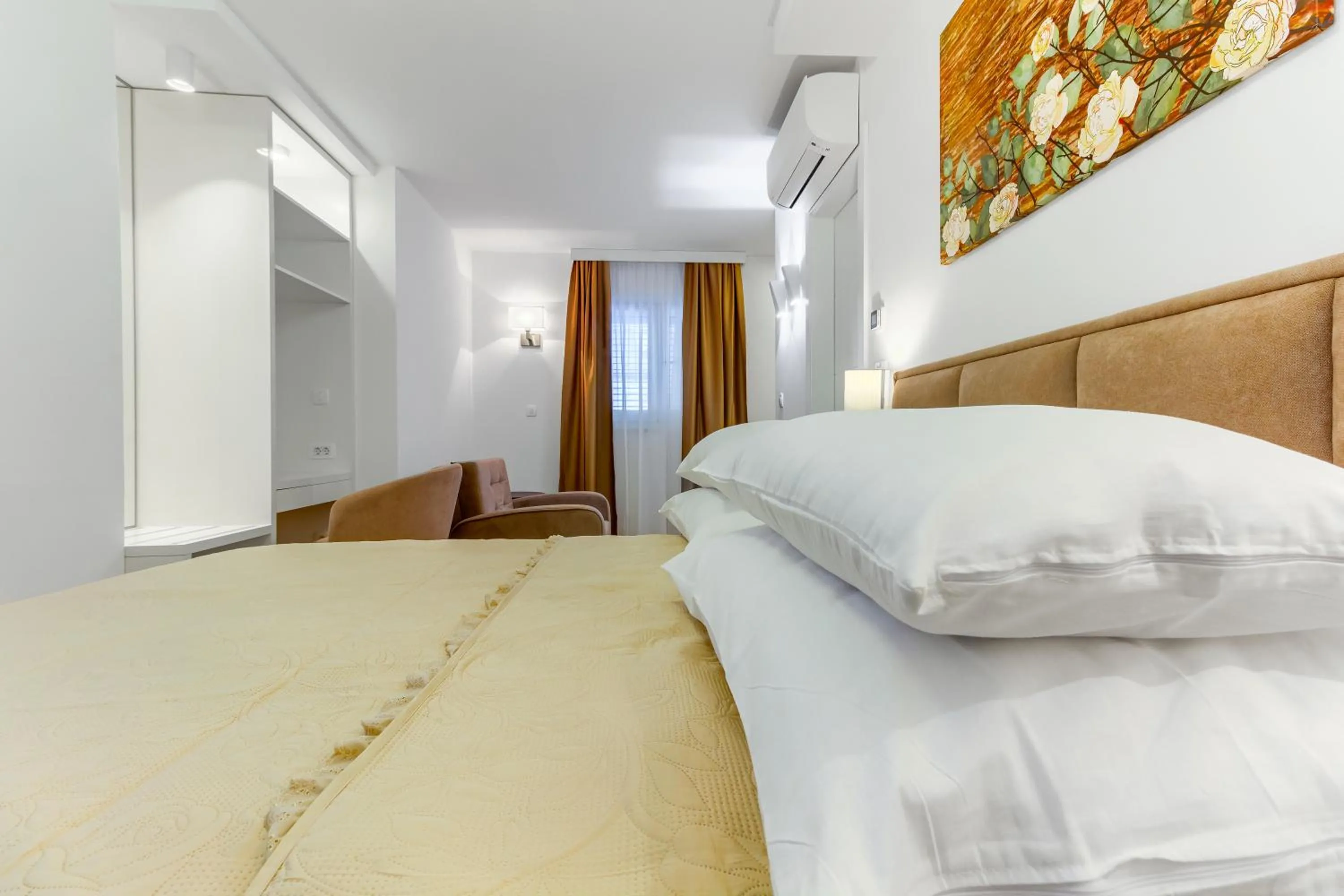 Bed in Irini Luxury Rooms