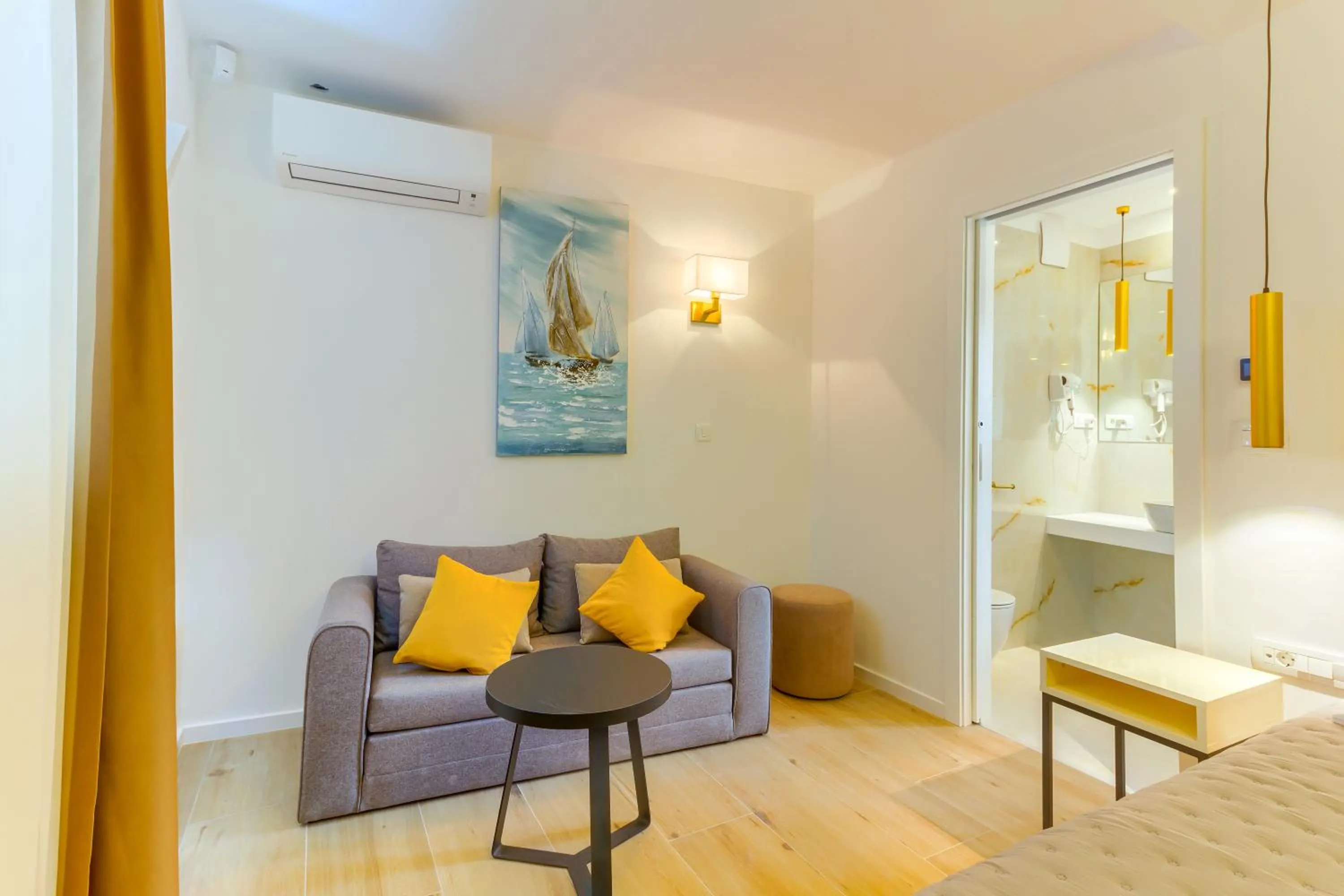 Bed in Irini Luxury Rooms