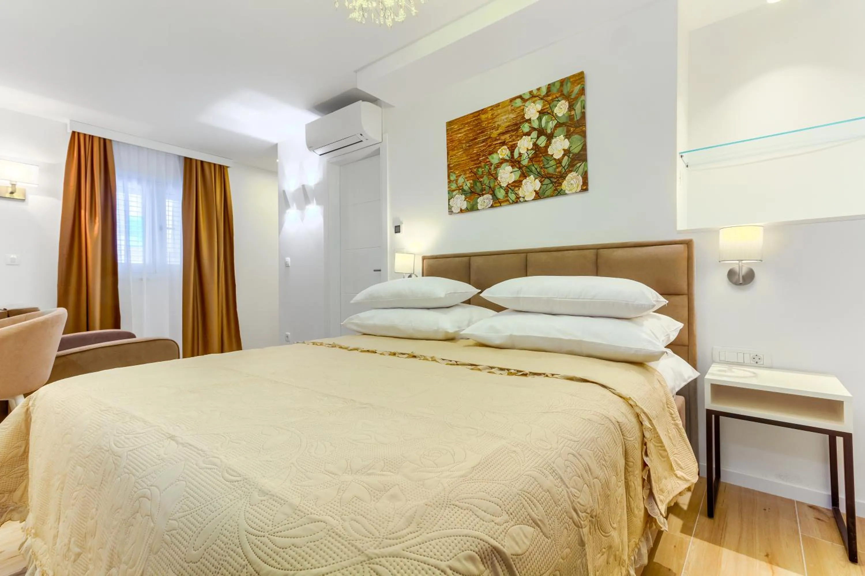 Bed in Irini Luxury Rooms