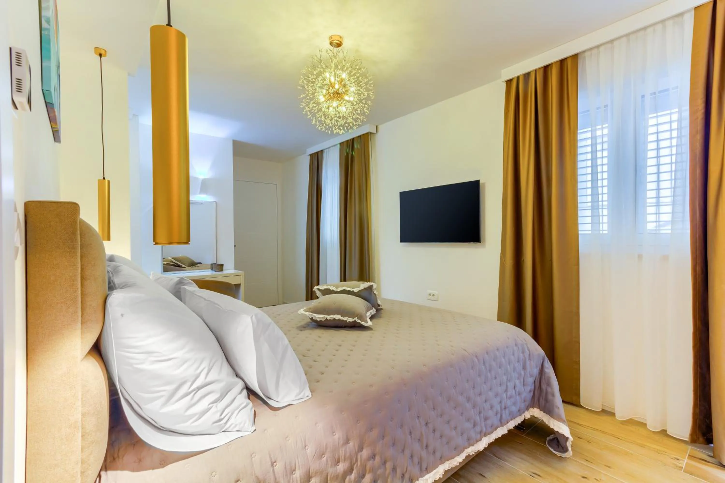Bed in Irini Luxury Rooms